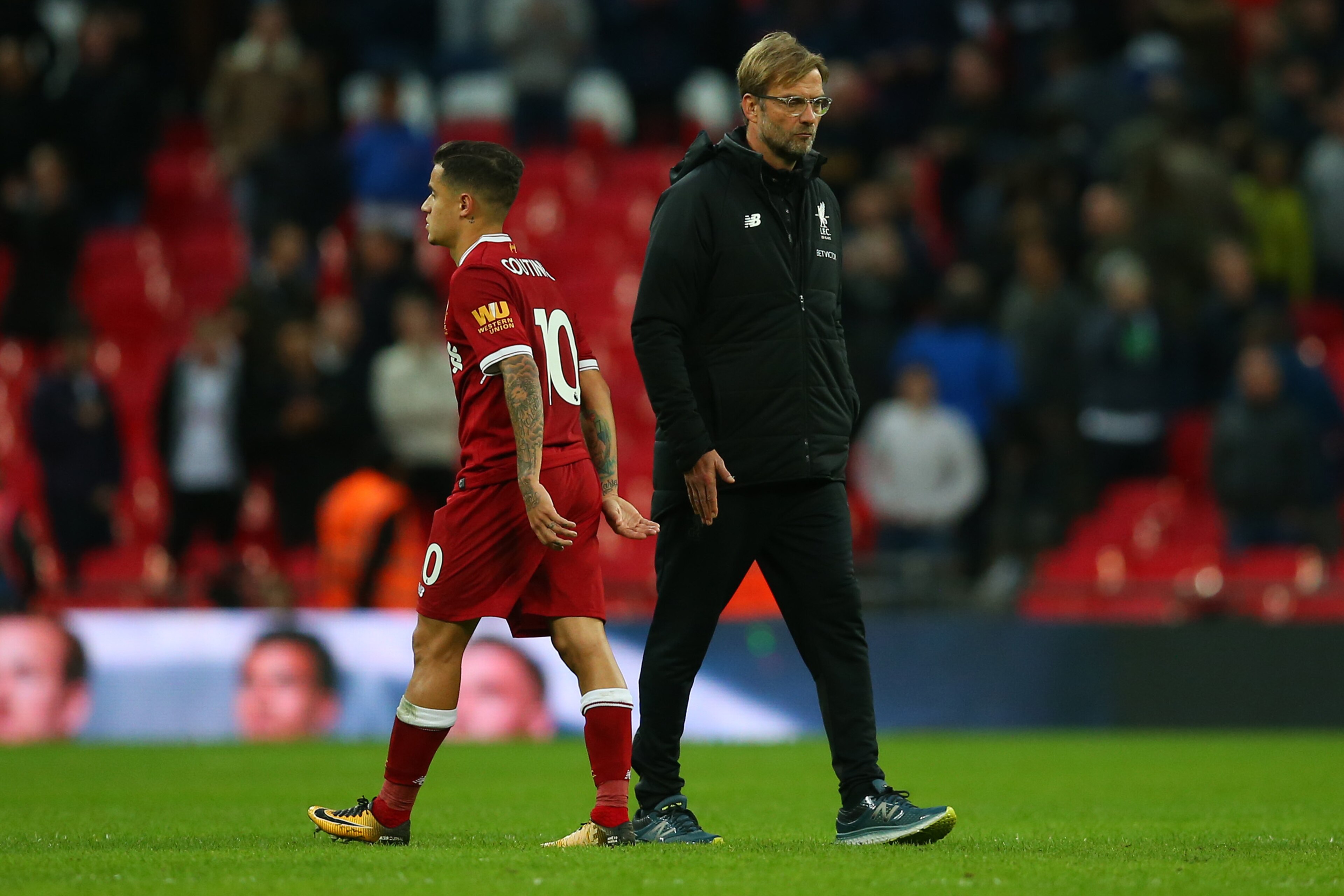 LONDON, ENGLAND - OCTOBER 22: Jurgen Klopp the head coach / manager of Liverpool walks past Philippe Coutinho of Liverpool after the Premier League match between Tottenham Hotspur and Liverpool at Wembley Stadium on October 22, 2017 in London, England. (P