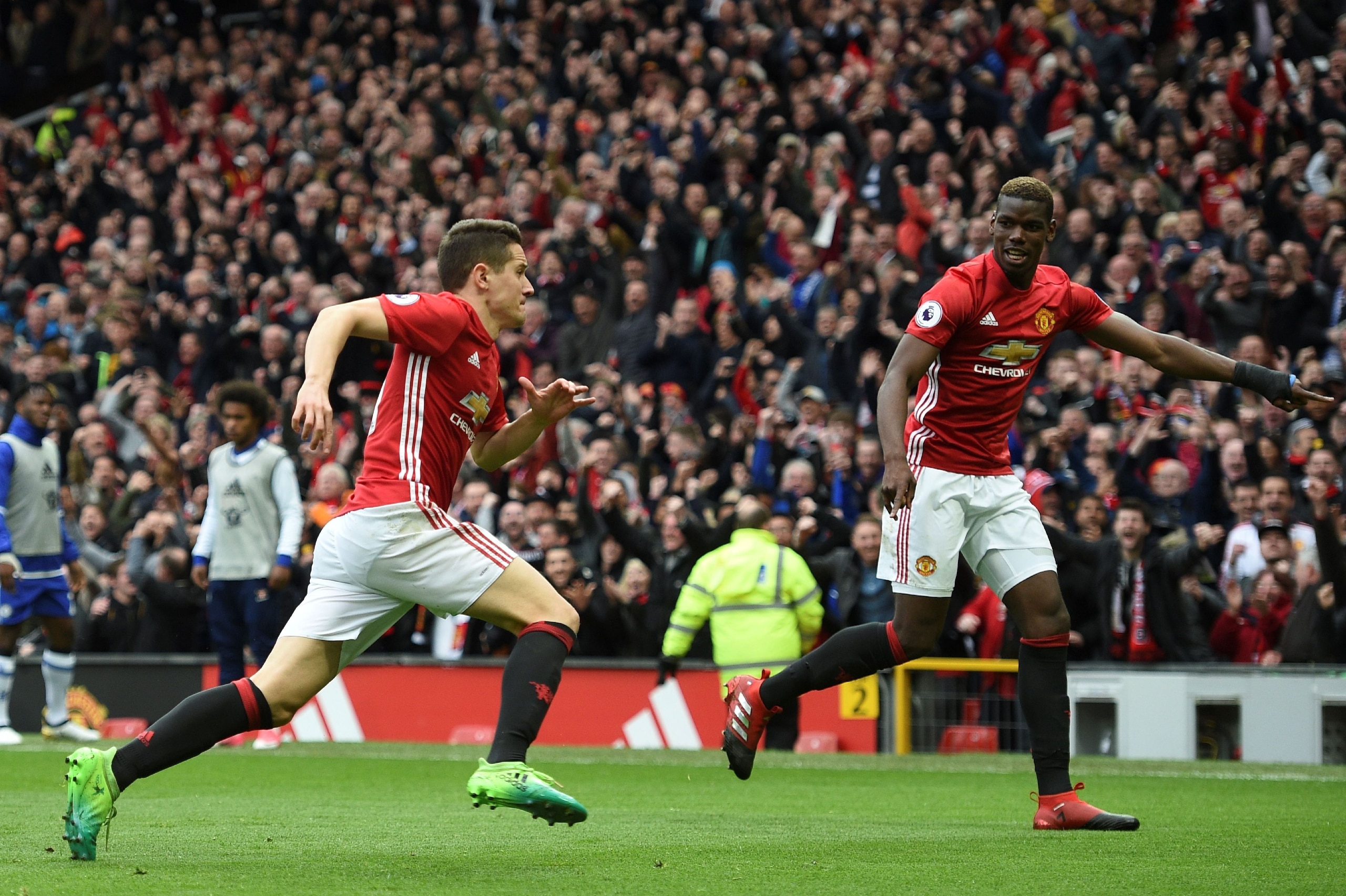 Manchester United's Spanish midfielder Ander Herrera (L) celebrates scoring their second goal with Manchester United's French midfielder Paul Pogba during the English Premier League football match between Manchester United and Chelsea at Old Trafford in M Manchester United's Spanish midfielder Ander Herrera (L) celebrates scoring their second goal with Manchester United's French midfielder Paul Pogba during the English Premier League football match between Manchester United and Chelsea at Old Trafford in M