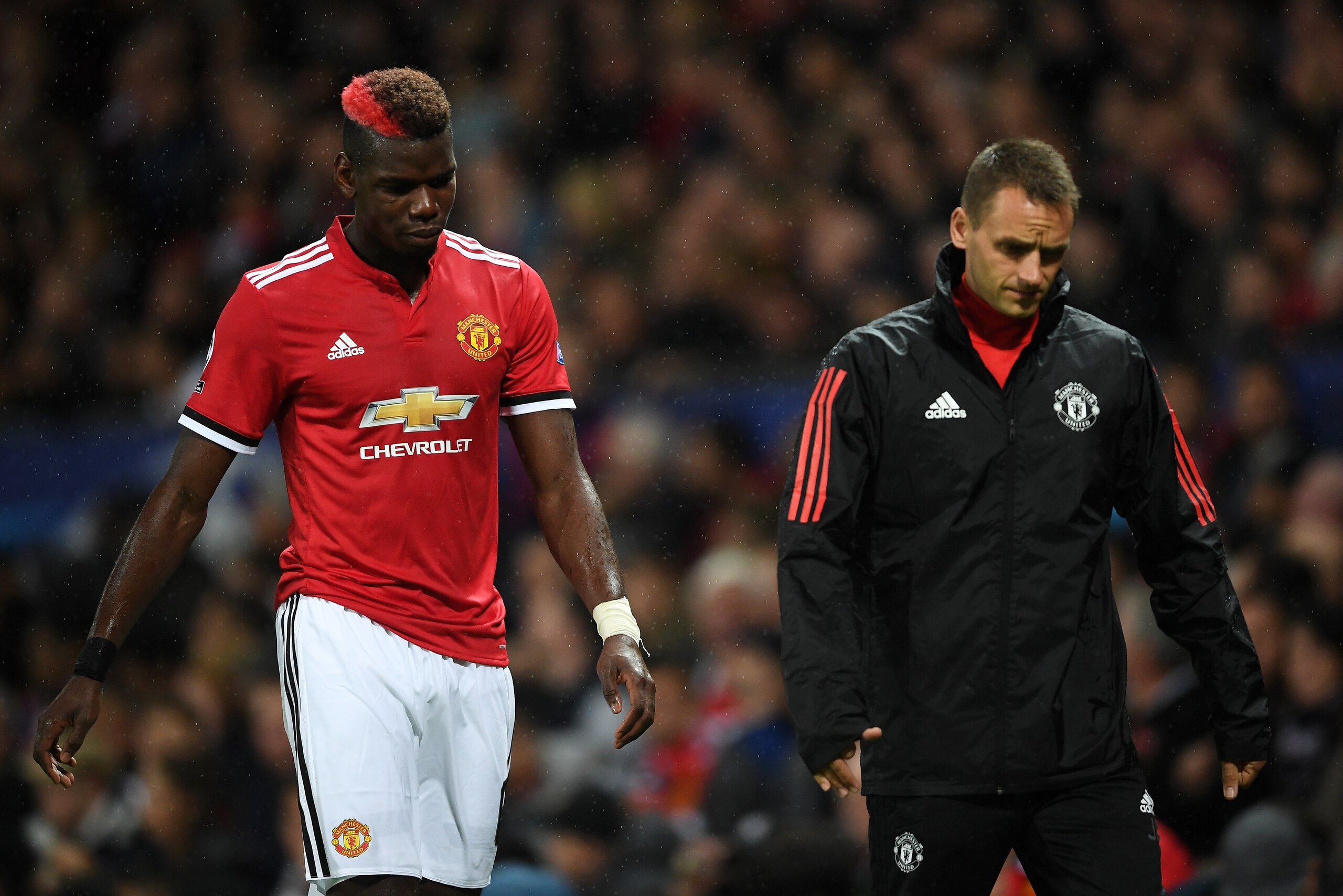 MANCHESTER, ENGLAND - SEPTEMBER 12:  Paul Pogba of ManchesterUnited reacts to being forced off through injury during the UEFA Champions League Group A match between Manchester United and FC Basel at Old Trafford on September 12, 2017 in Manchester, United