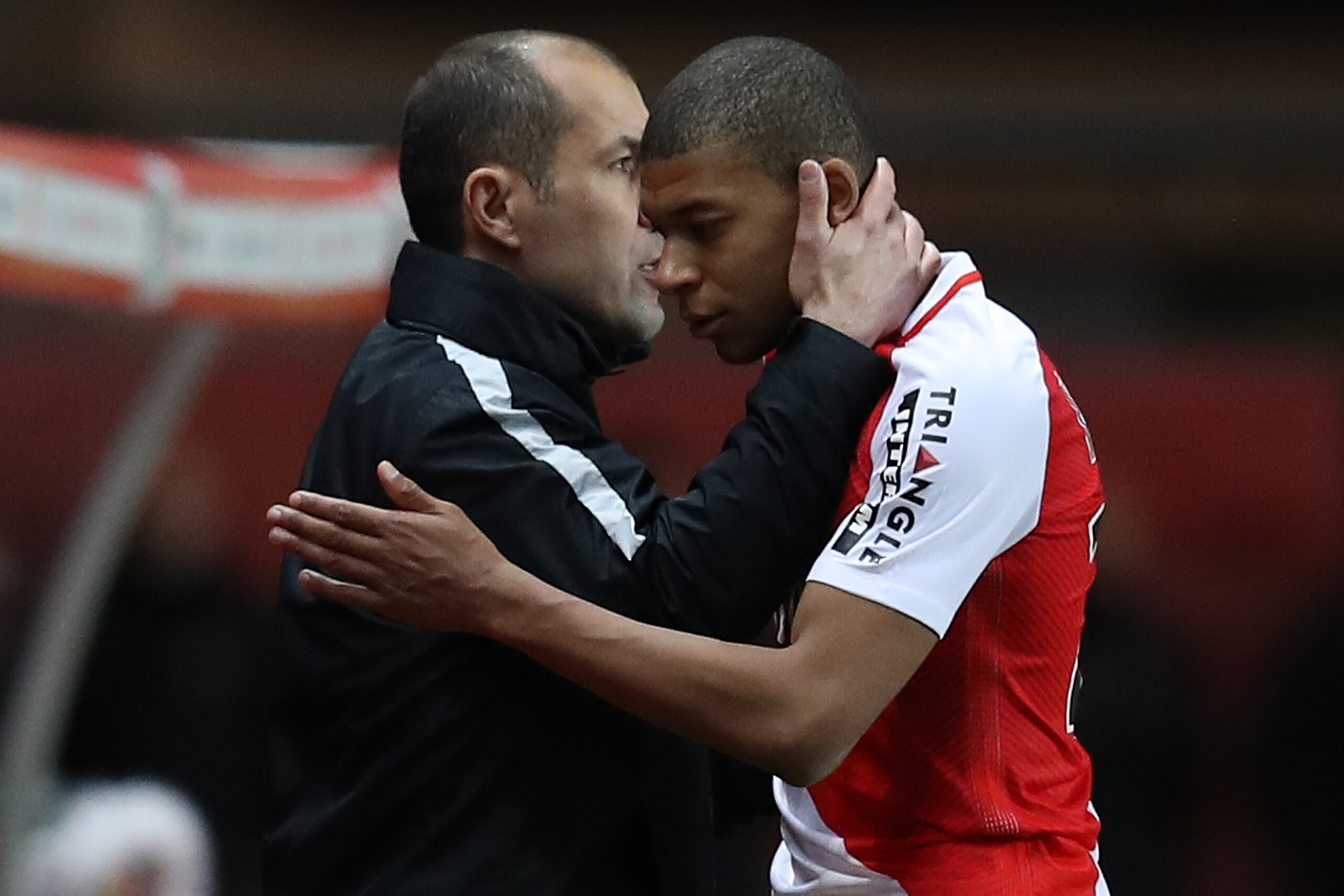 Monaco's French forward Kylian Mbappe Lottin (R) is congratulated by Monaco's Portuguese coach Leonardo Jardim as he leaves the pitch during the French L1 football match Monaco (ASM) vs Nantes (FCN) on March 5, 2017 at the 'Louis II Stadium' in Monaco.   