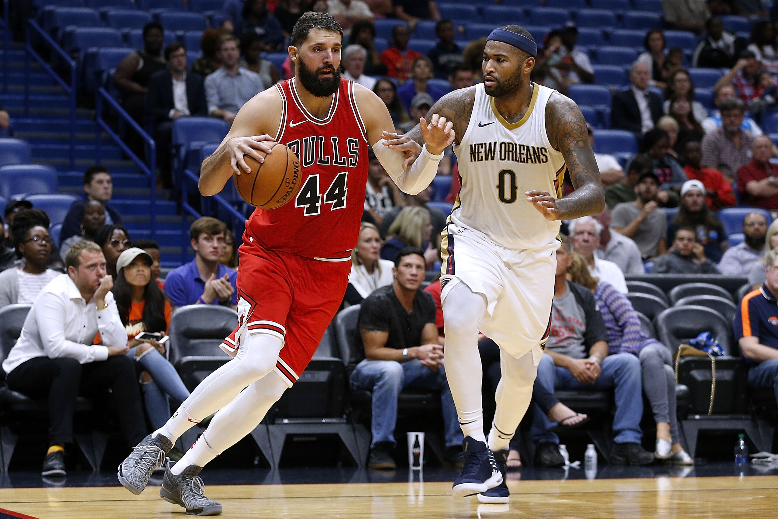 NEW ORLEANS, LA - OCTOBER 03:  Nikola Mirotic #44 of the Chicago Bulls drives against DeMarcus Cousins #0 of the New Orleans Pelicans during a preseason game at the Smoothie King Center on October 3, 2017 in New Orleans, Louisiana. NOTE TO USER: User expr