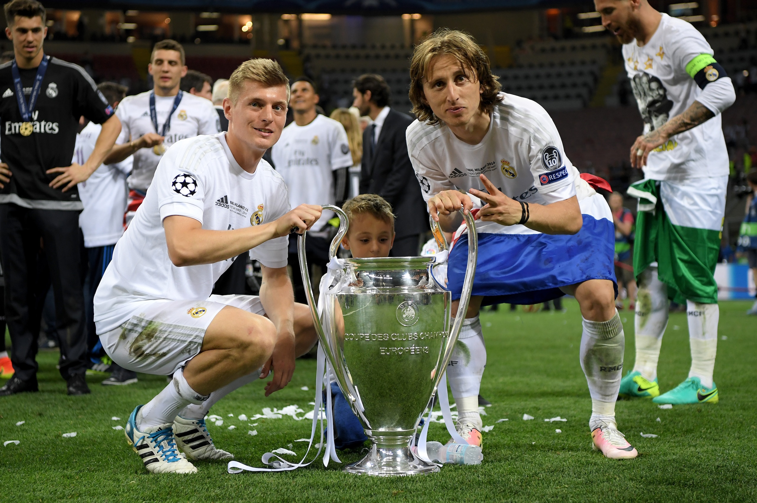 MILAN, ITALY - MAY 28: Toni Kroos of Real Madrid and Luka Modric of Real Madrid celebrate with the Champions League trophy after the UEFA Champions League Final match between Real Madrid and Club Atletico de Madrid at Stadio Giuseppe Meazza on May 28, 20 MILAN, ITALY - MAY 28: Toni Kroos of Real Madrid and Luka Modric of Real Madrid celebrate with the Champions League trophy after the UEFA Champions League Final match between Real Madrid and Club Atletico de Madrid at Stadio Giuseppe Meazza on May 28, 20
