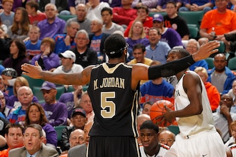 SUNRISE, FL - DECEMBER 18: Marcus Jordan #5 of the Central Florida Knights defends as Durand Scott #1 of the Miami Hurricanes attempts to inbound the ball on December 18, 2010 at the BankAtlantic Center in Sunrise, Florida. The Knights defeated the Hurric