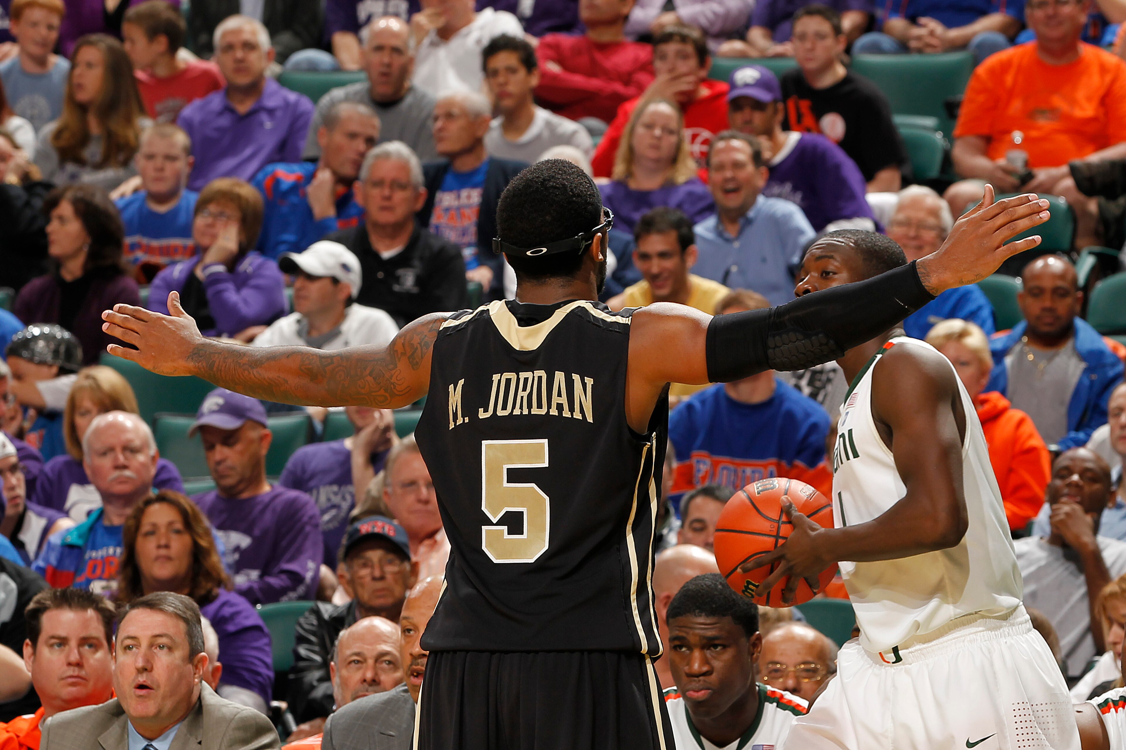 SUNRISE, FL - DECEMBER 18: Marcus Jordan #5 of the Central Florida Knights defends as Durand Scott #1 of the Miami Hurricanes attempts to inbound the ball on December 18, 2010 at the BankAtlantic Center in Sunrise, Florida. The Knights defeated the Hurric