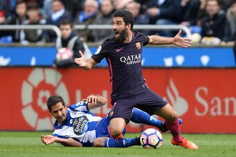 LA CORUNA, SPAIN - MARCH 12: Celso Borges of RC Deportivo La Coruna competes for the ball with Arda Turan of FC Barcelona during the La Liga match between RC Deportivo La Coruna and FC Barcelona at Riazor Stadium on March 12, 2017 in La Coruna, Spain. (Ph