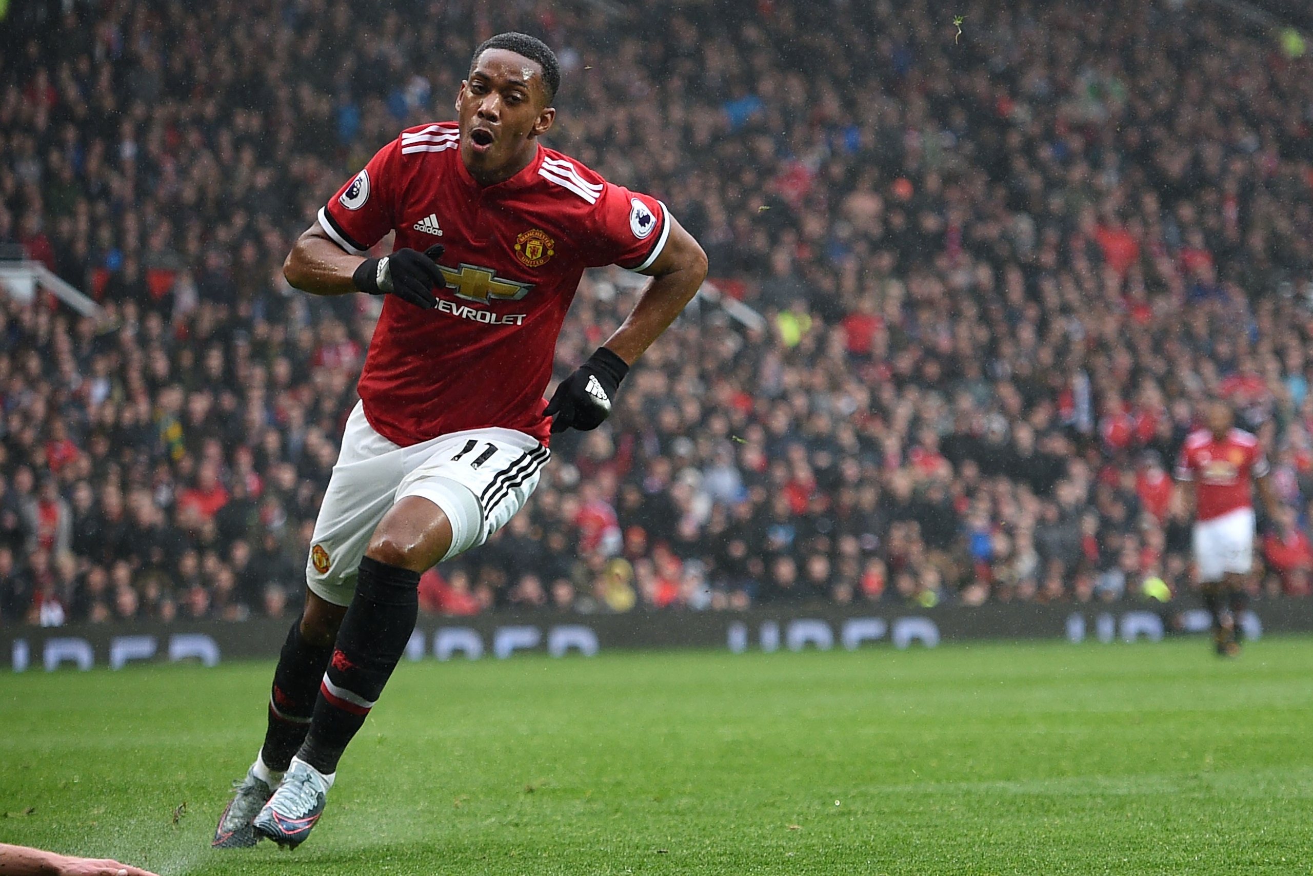 Manchester United's French striker Anthony Martial celebrates after scoring the opening goal of the English Premier League football match between Manchester United and Tottenham Hotspur at Old Trafford in Manchester, north west England, on October 28, 201