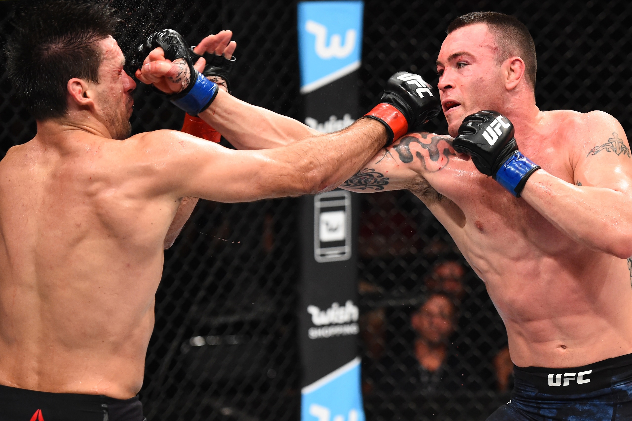 SAO PAULO, BRAZIL - OCTOBER 28:  (R-L) Colby Covington punches Demian Maia of Brazil in their welterweight bout during the UFC Fight Night event inside the Ibirapuera Gymnasium on October 28, 2017 in Sao Paulo, Brazil. (Photo by Josh Hedges/Zuffa LLC/Zuff