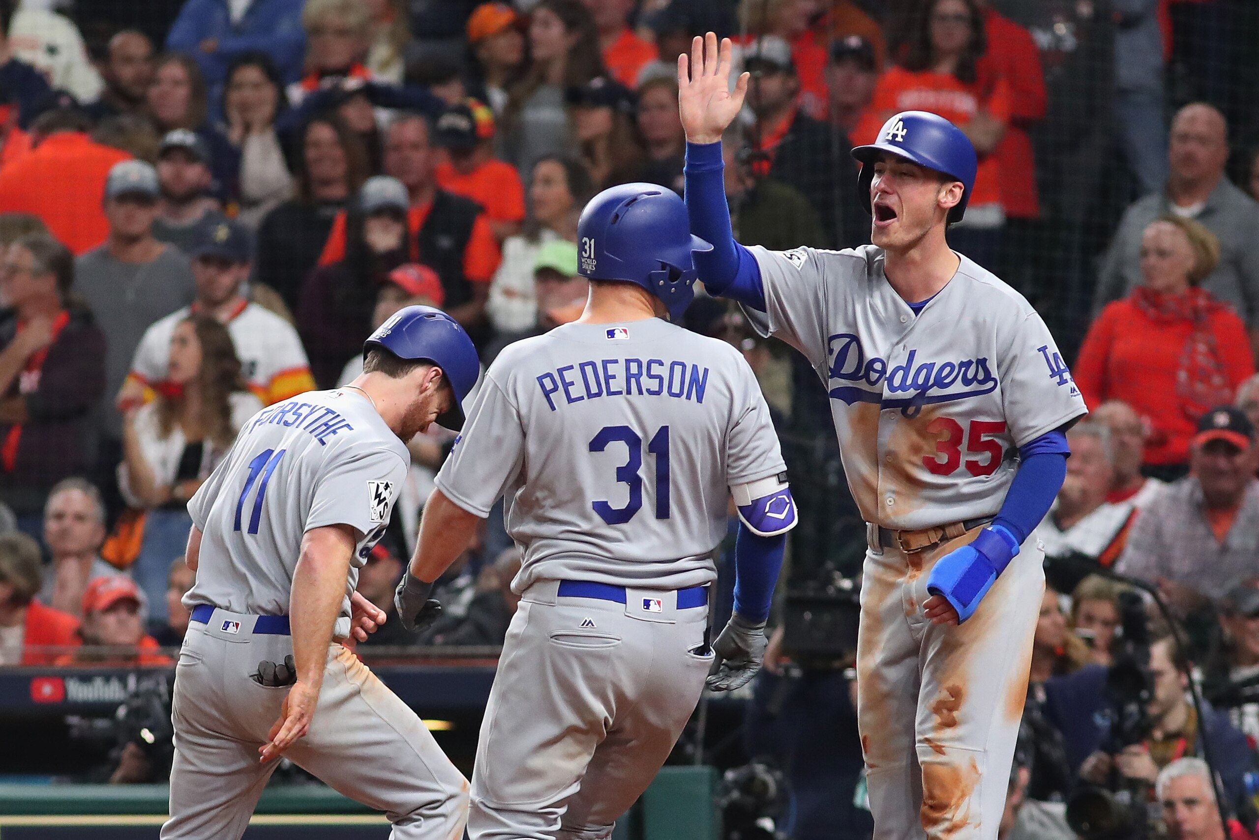 HOUSTON, TX - OCTOBER 28:  Joc Pederson #31 of the Los Angeles Dodgers celebrates hitting a three-run home run during the ninth inning against the Houston Astros in game four of the 2017 World Series at Minute Maid Park on October 28, 2017 in Houston, Tex