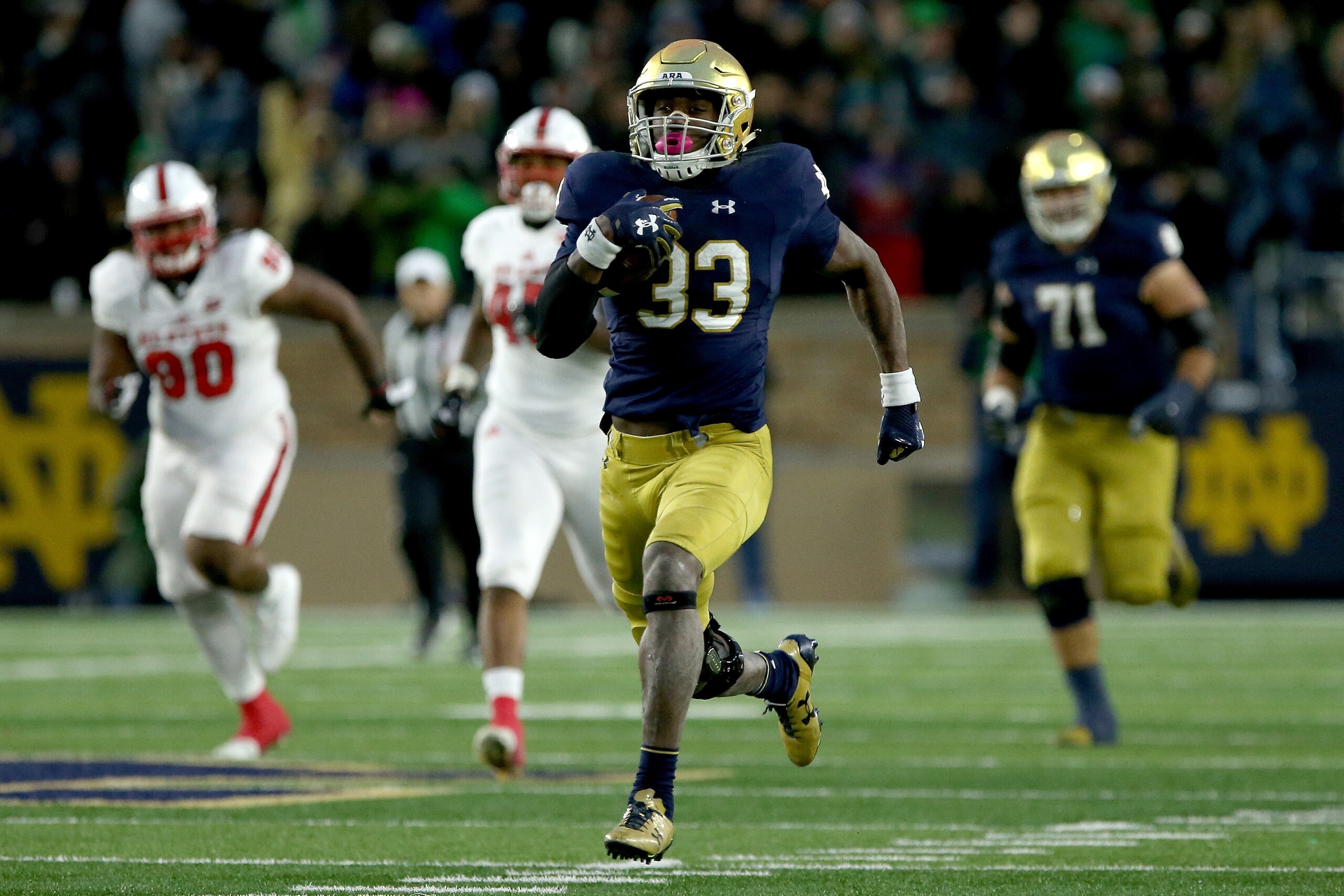 SOUTH BEND, IN - OCTOBER 28: Josh Adams #33 of the Notre Dame Fighting Irish runs with the ball in the third quarter against the North Carolina State Wolfpack at Notre Dame Stadium on October 28, 2017 in South Bend, Indiana. (Photo by Dylan Buell/Getty Im