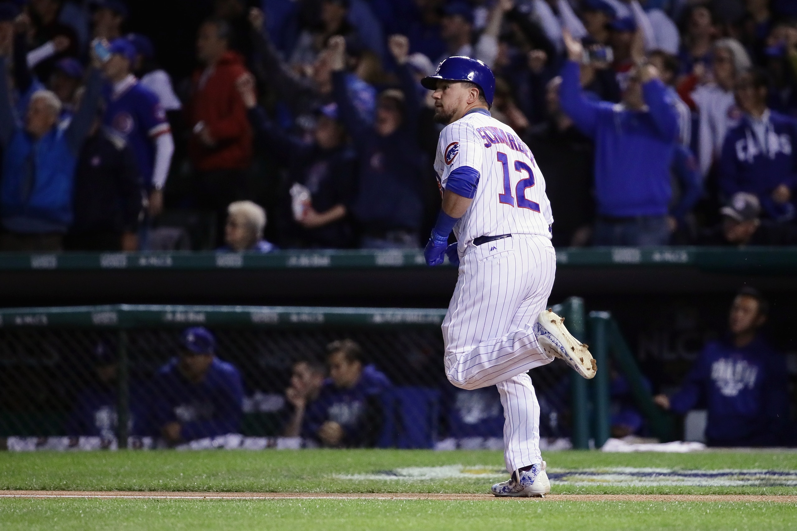 CHICAGO, IL - OCTOBER 17:  Kyle Schwarber #12 of the Chicago Cubs rounds the bases after hitting a home run in the first inning against the Los Angeles Dodgers during game three of the National League Championship Series at Wrigley Field on October 17, 20