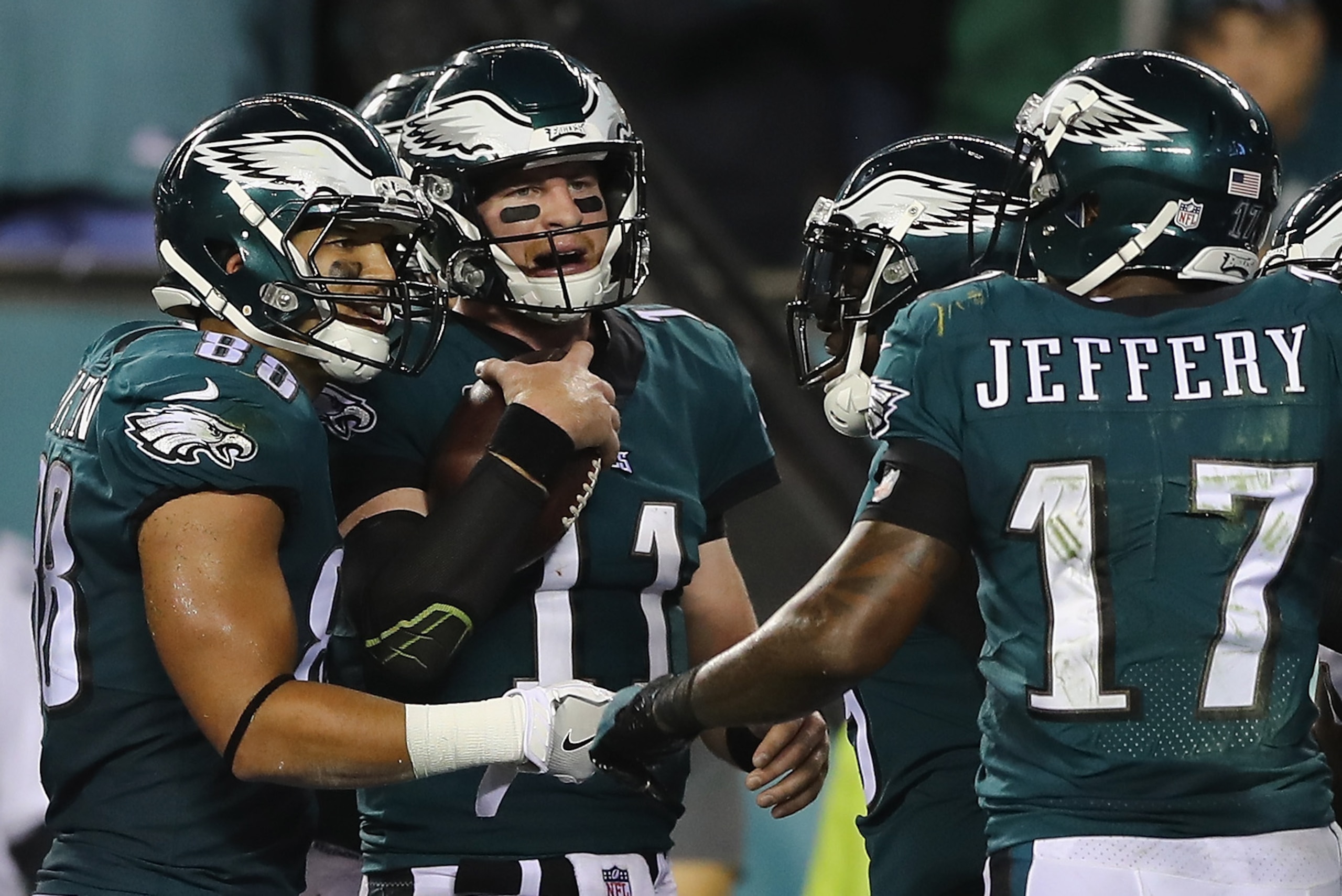 PHILADELPHIA, PA - OCTOBER 23:  Quarterback Carson Wentz #11 of the Philadelphia Eagles celebrates a touchdown by Zach Ertz #86 with Trey Burton #88 and Alshon Jeffery #17 during the second quarter of the game against the Washington Redskins at Lincoln Fi