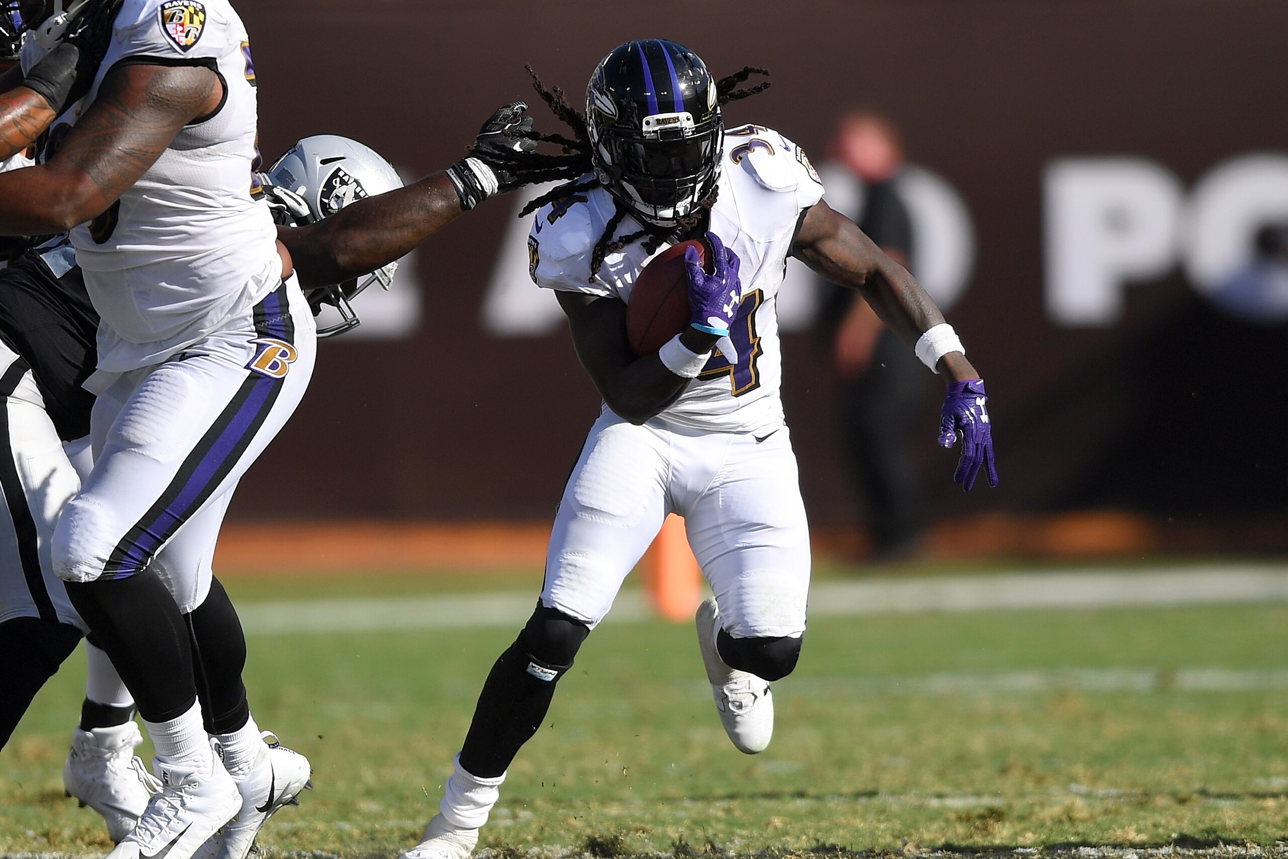 OAKLAND, CA - OCTOBER 08: Alex Collins #34 of the Baltimore Ravens carries the ball against the Oakland Raiders during the fourth quarter of their NFL football game at Oakland-Alameda County Coliseum on October 8, 2017 in Oakland, California. (Photo by OAKLAND, CA - OCTOBER 08: Alex Collins #34 of the Baltimore Ravens carries the ball against the Oakland Raiders during the fourth quarter of their NFL football game at Oakland-Alameda County Coliseum on October 8, 2017 in Oakland, California. (Photo by