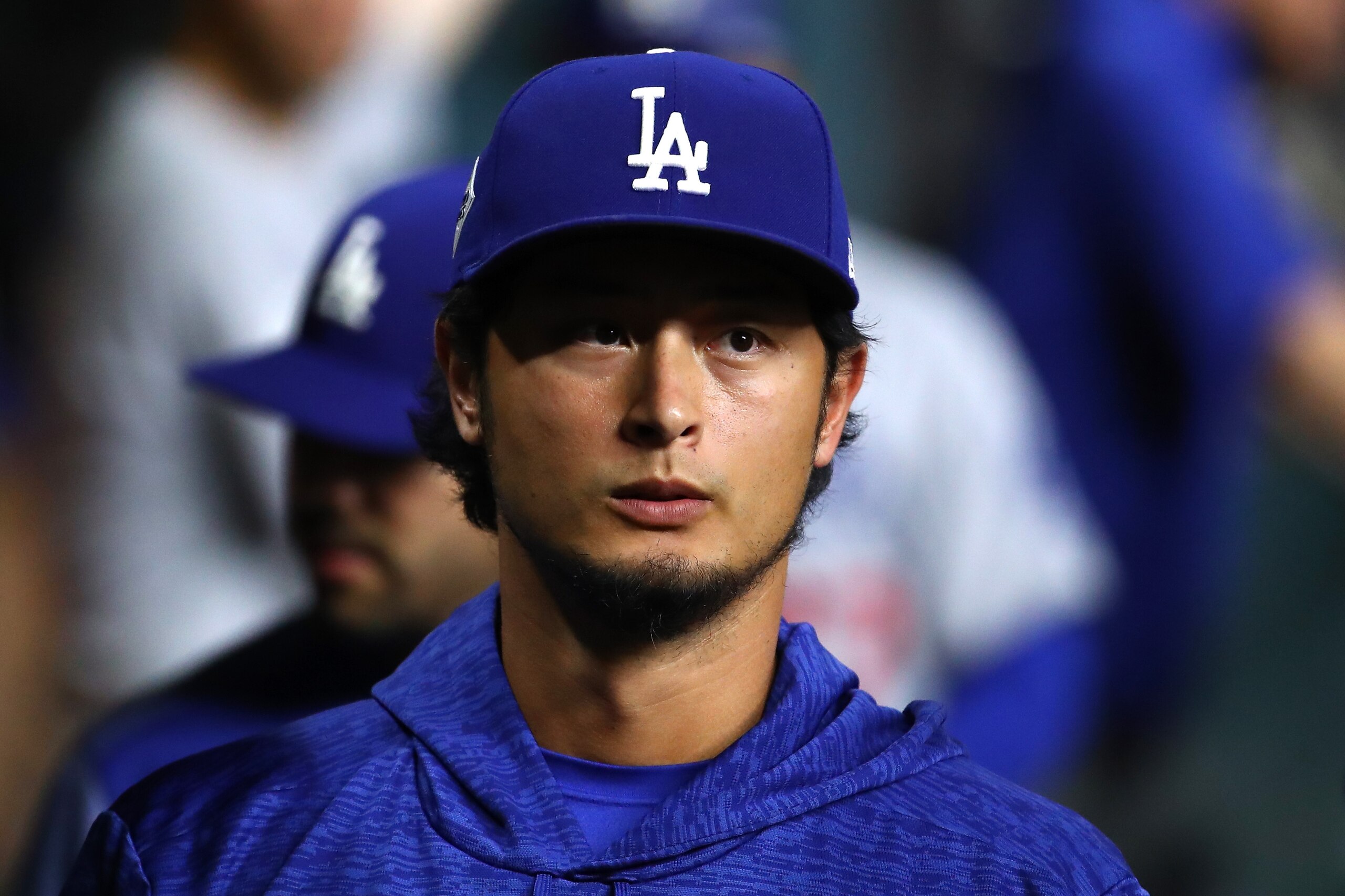 HOUSTON, TX - OCTOBER 28:  Yu Darvish #21 of the Los Angeles Dodgers looks on from the dugout before game four of the 2017 World Series against the Houston Astros at Minute Maid Park on October 28, 2017 in Houston, Texas.  (Photo by Ezra Shaw/Getty Images