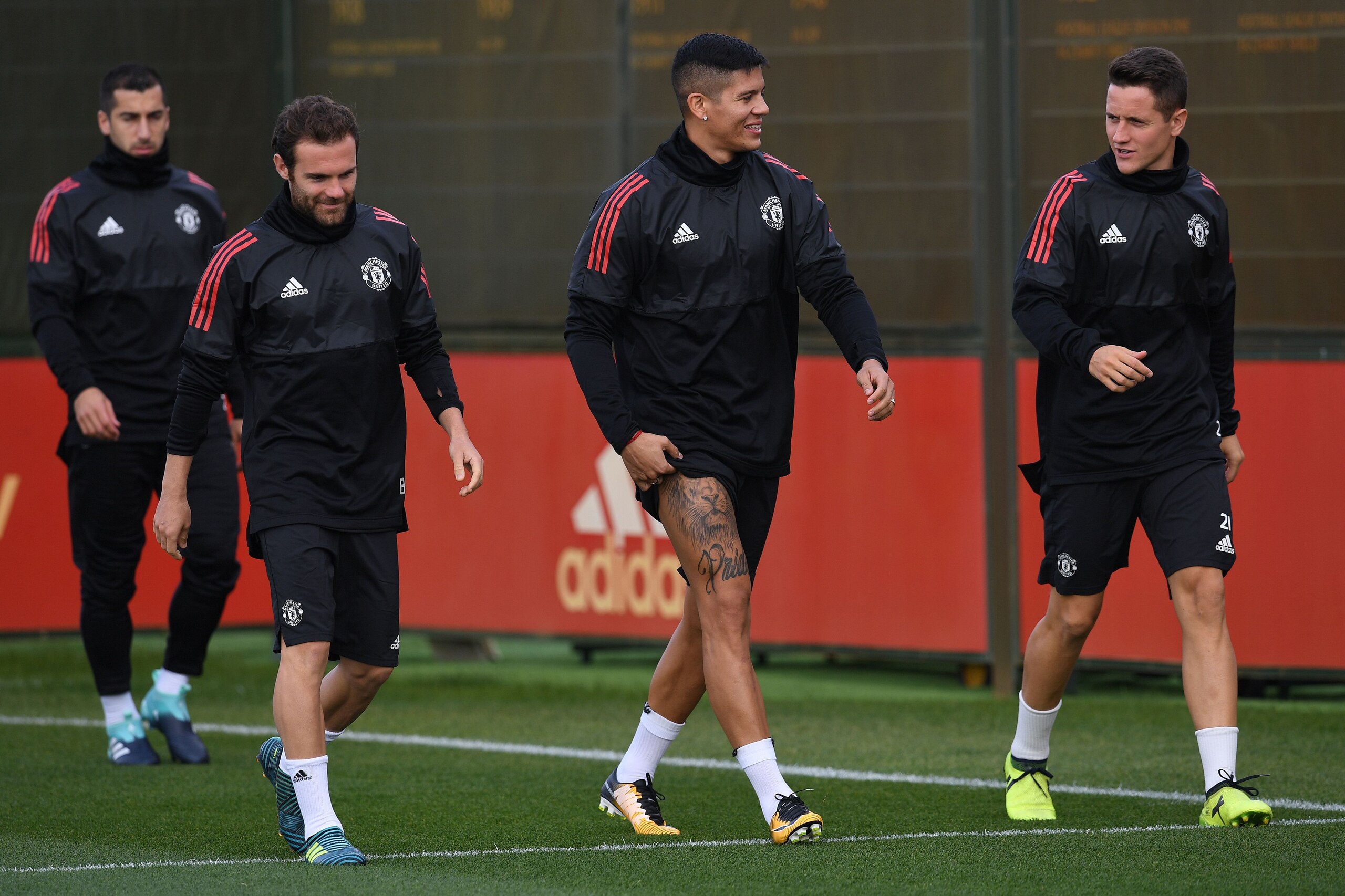 Manchester United's Armenian midfielder Henrikh Mkhitaryan (L), Manchester United's Spanish midfielder Juan Mata (2L), Manchester United's Argentinian defender Marcos Rojo  and Manchester United's Spanish midfielder Ander Herrera attends a team training s