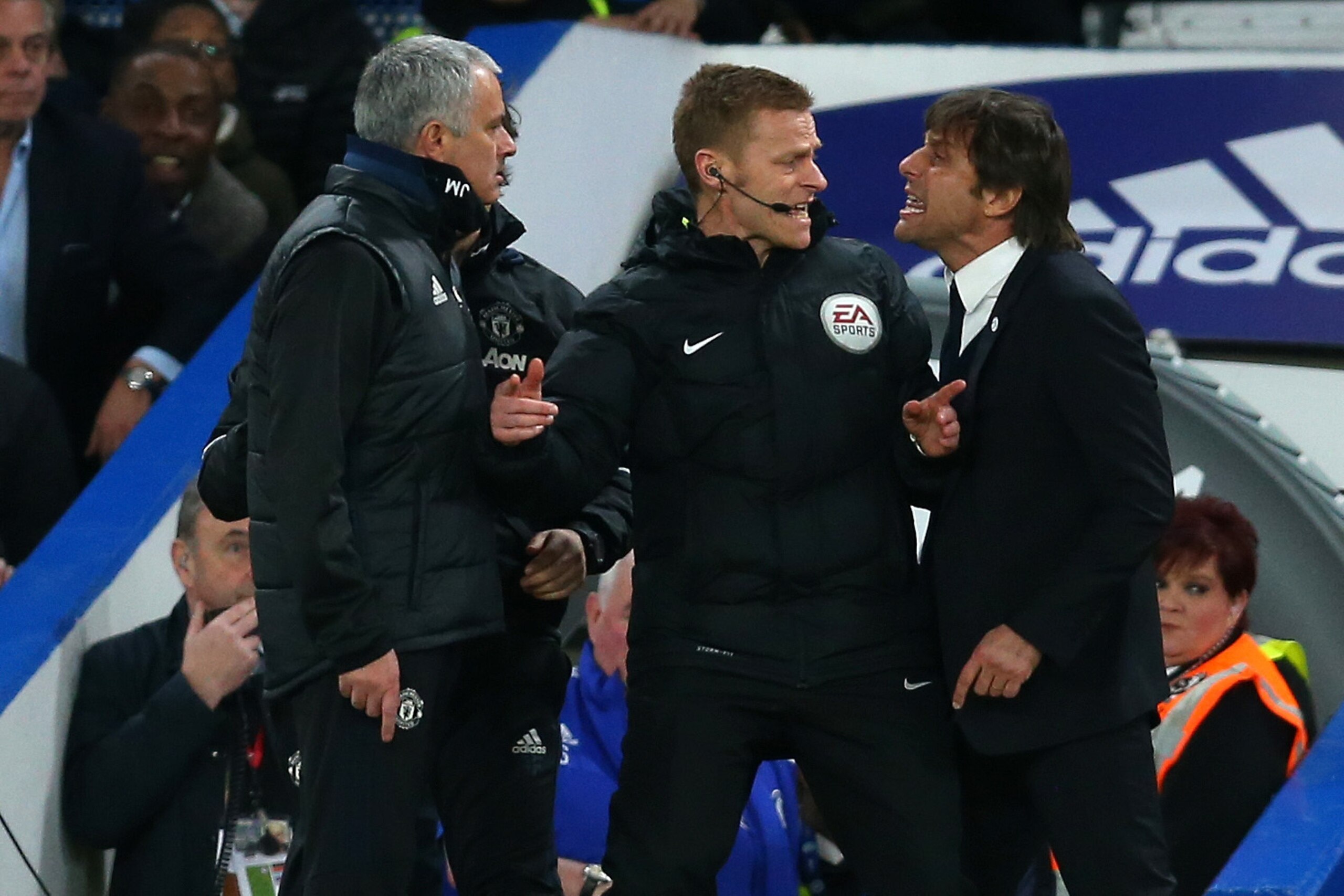 LONDON, ENGLAND - MARCH 13: Jose Mourinho Manager of Manchester United and Antonio Conte manager of Chelsea have words and are separated by fourth official Mike Jones during The Emirates FA Cup Quarter-Final match between Chelsea and Manchester United at 