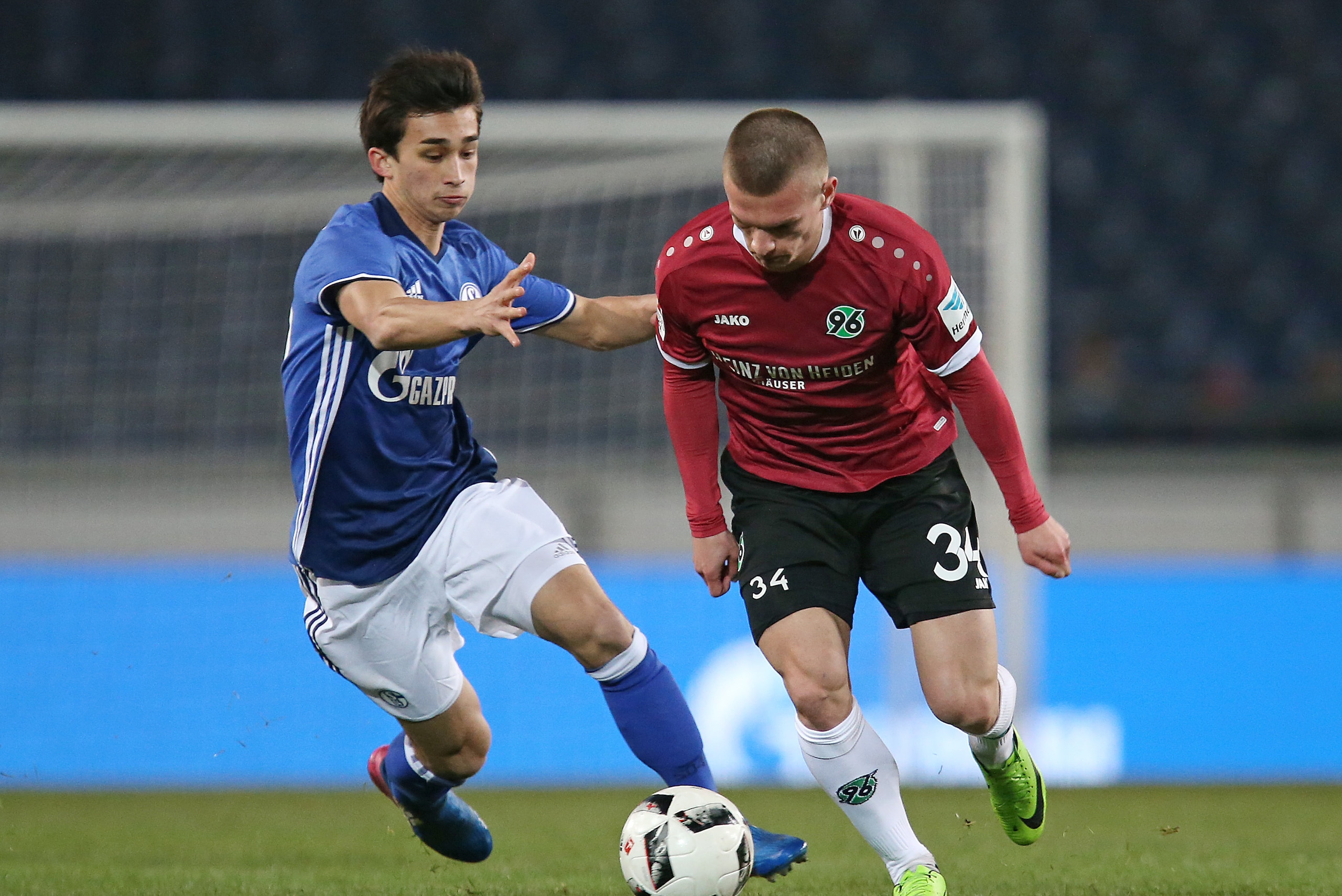 HANOVER, GERMANY - MARCH 23: Nick Taitague of Schalke and Tim Dierssen of Hannover battle for the ball during the friendly match between Hannover 96 an FC Schalke 04 at HDI-Arena on March 23, 2017 in Hannover, Germany. (Photo by TF-Images/Getty Images)