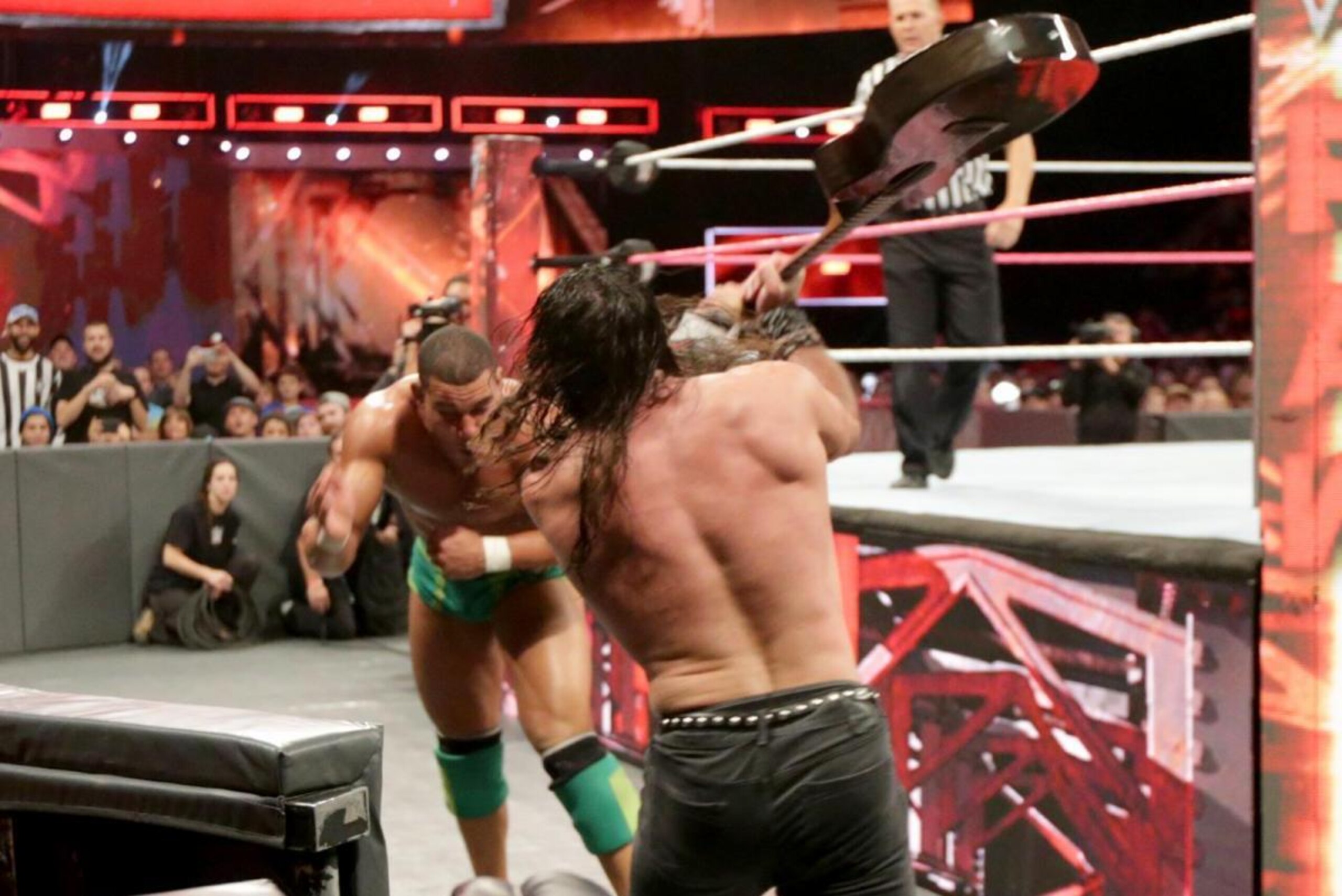 Elias attacks Jason Jordan with a guitar.