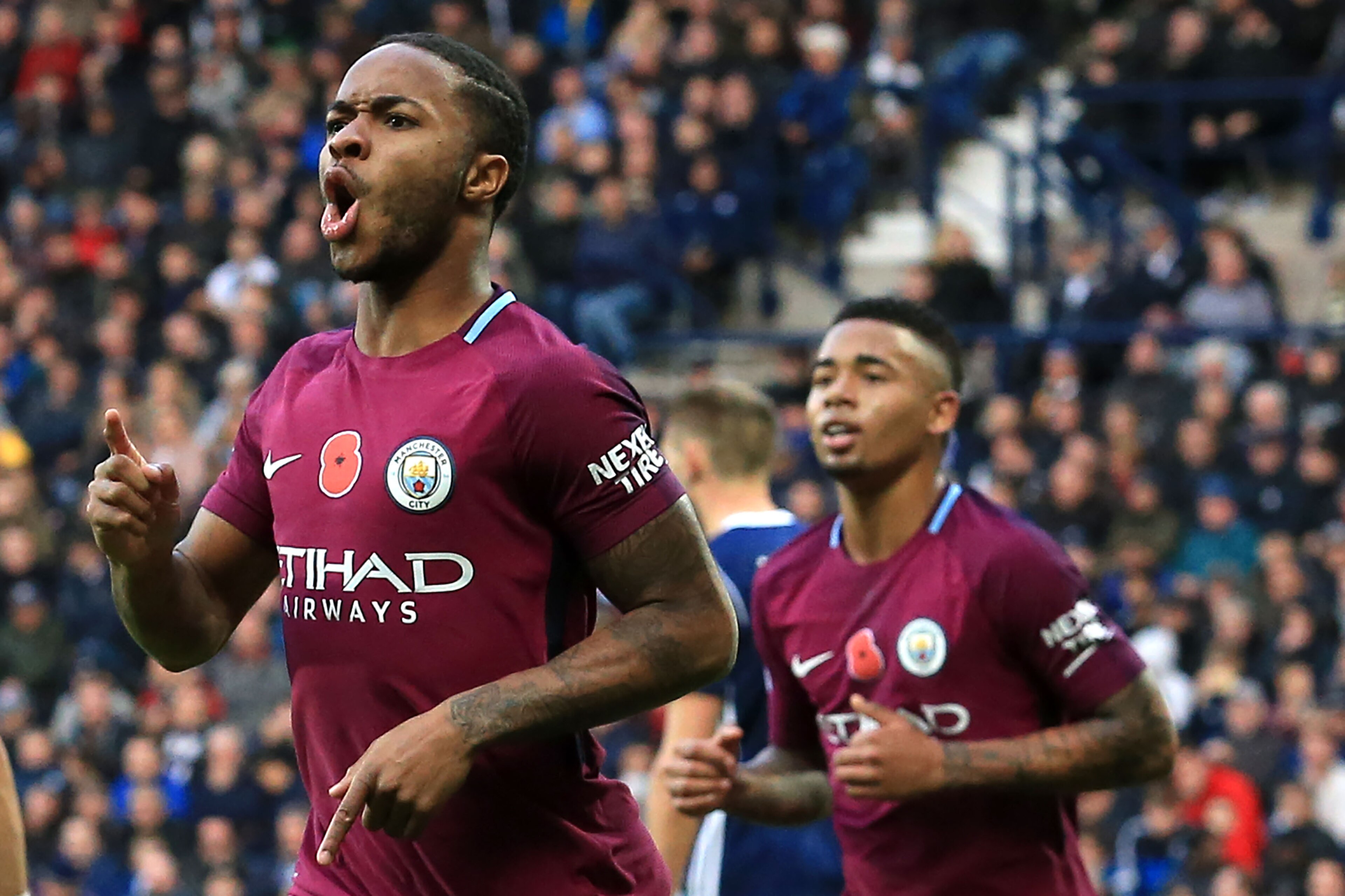 Manchester City's English midfielder Raheem Sterling celebrates scoring the team's third goal during the English Premier League football match between West Bromwich Albion and Manchester City at The Hawthorns stadium in West Bromwich, central England, on 