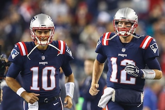 FOXBORO, MA - OCTOBER 22:  Tom Brady #12 and Jimmy Garoppolo #10 of the New England Patriots run onto the field before a game against the Atlanta Falcons at Gillette Stadium on October 22, 2017 in Foxboro, Massachusetts.  (Photo by Maddie Meyer/Getty Imag