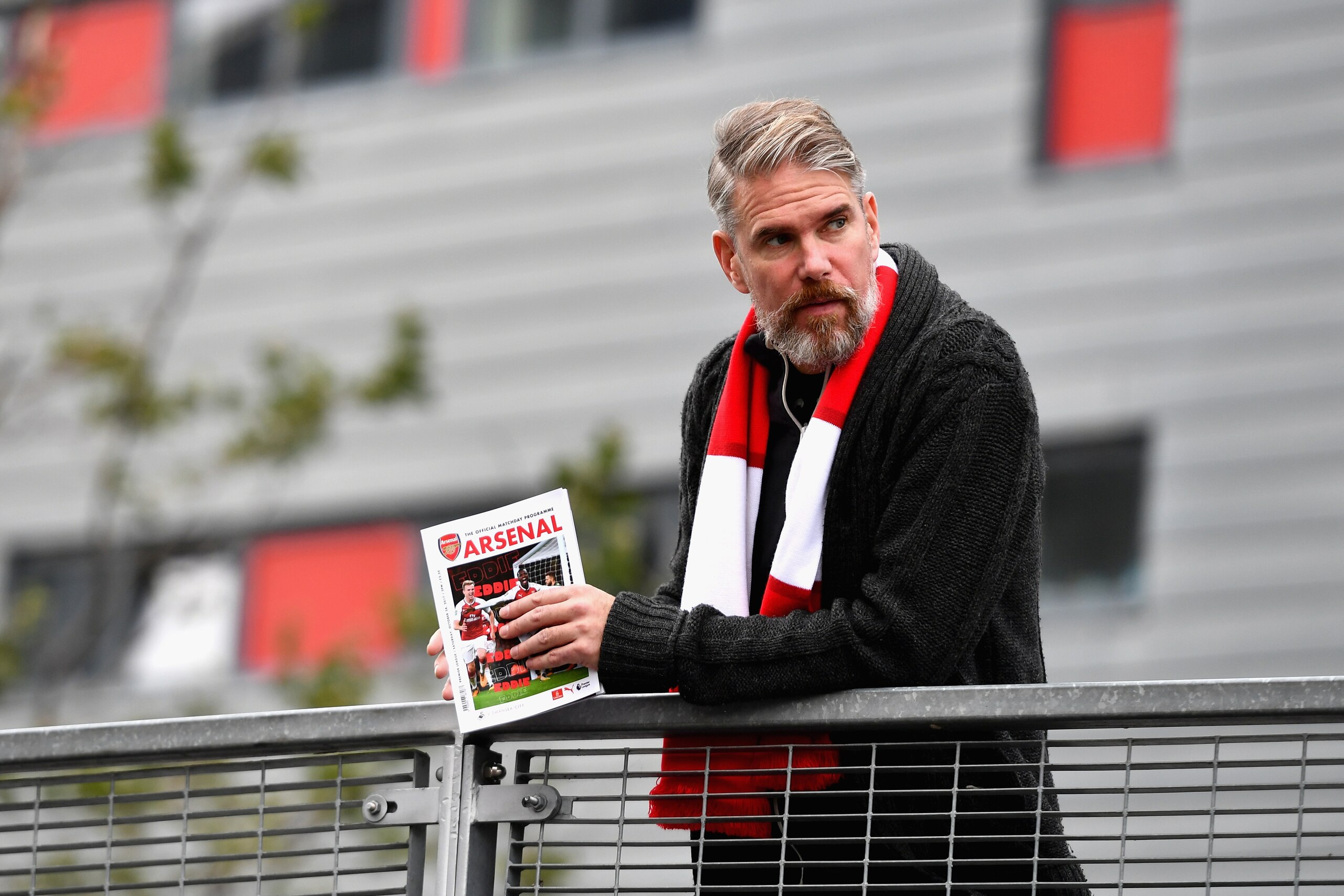 LONDON, ENGLAND - OCTOBER 28:  A fan reads a match day programme prior to the Premier League match between Arsenal and Swansea City at Emirates Stadium on October 28, 2017 in London, England.  (Photo by Dan Mullan/Getty Images)