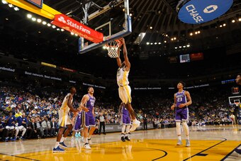 OAKLAND, CA - OCTOBER 13: Kevon Looney #5 of the Golden State Warriors shoots the ball during preseason game against the Sacramento Kings on October 13, 2017 at ORACLE Arena in Oakland, California. NOTE TO USER: User expressly acknowledges and agrees that