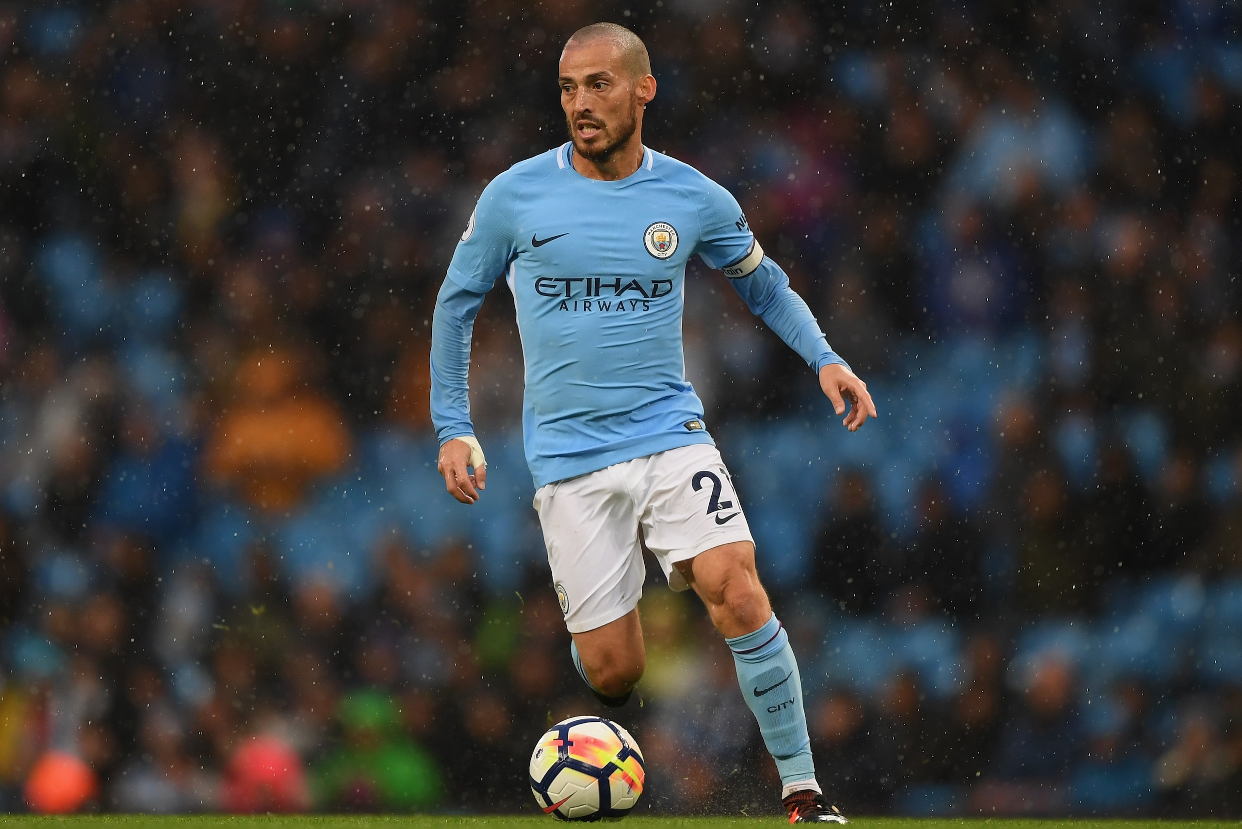 MANCHESTER, ENGLAND - OCTOBER 21:  David Silva of Manchester City runs with the ball during the Premier League match between Manchester City and Burnley at Etihad Stadium on October 21, 2017 in Manchester, England.  (Photo by Shaun Botterill/Getty Images)