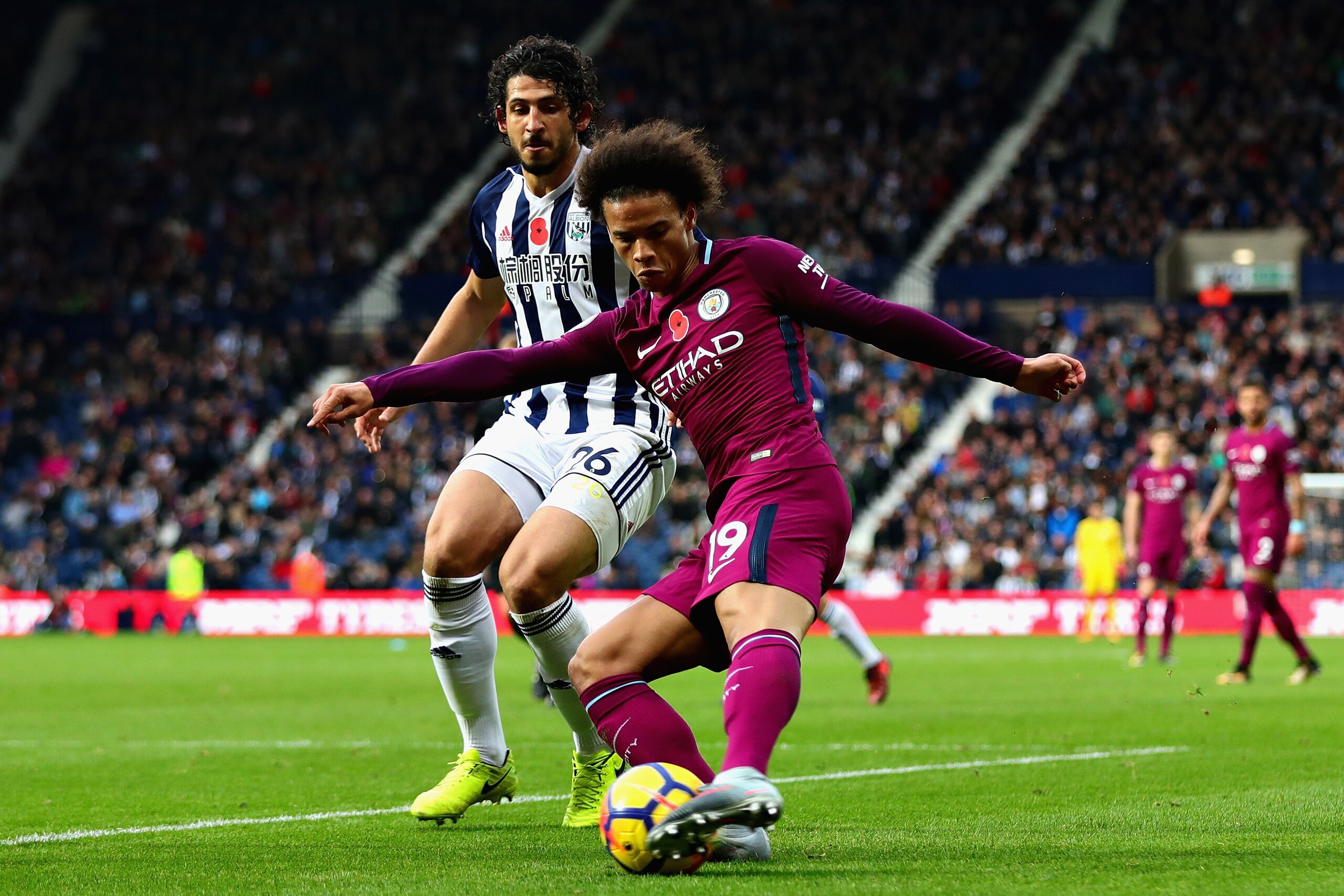 WEST BROMWICH, ENGLAND - OCTOBER 28: Leroy Sane of Manchester City and Ahmed Hegazy of West Bromwich Albion in action during the Premier League match between West Bromwich Albion and Manchester City at The Hawthorns on October 28, 2017 in West Bromwich, E