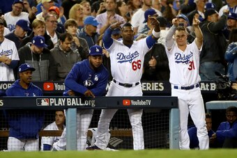 LOS ANGELES, CA - OCTOBER 31:  Yasiel Puig #66 and Joc Pederson #31 of the Los Angeles Dodgers react during the eighth inning against the Houston Astros in game six of the 2017 World Series at Dodger Stadium on October 31, 2017 in Los Angeles, California.