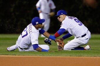 CHICAGO, IL - OCTOBER 19:  Addison Russell #27 and Javier Baez #9 of the Chicago Cubs attempt to field a ground ball in the fourth inning against the Los Angeles Dodgers during game five of the National League Championship Series at Wrigley Field on Octob
