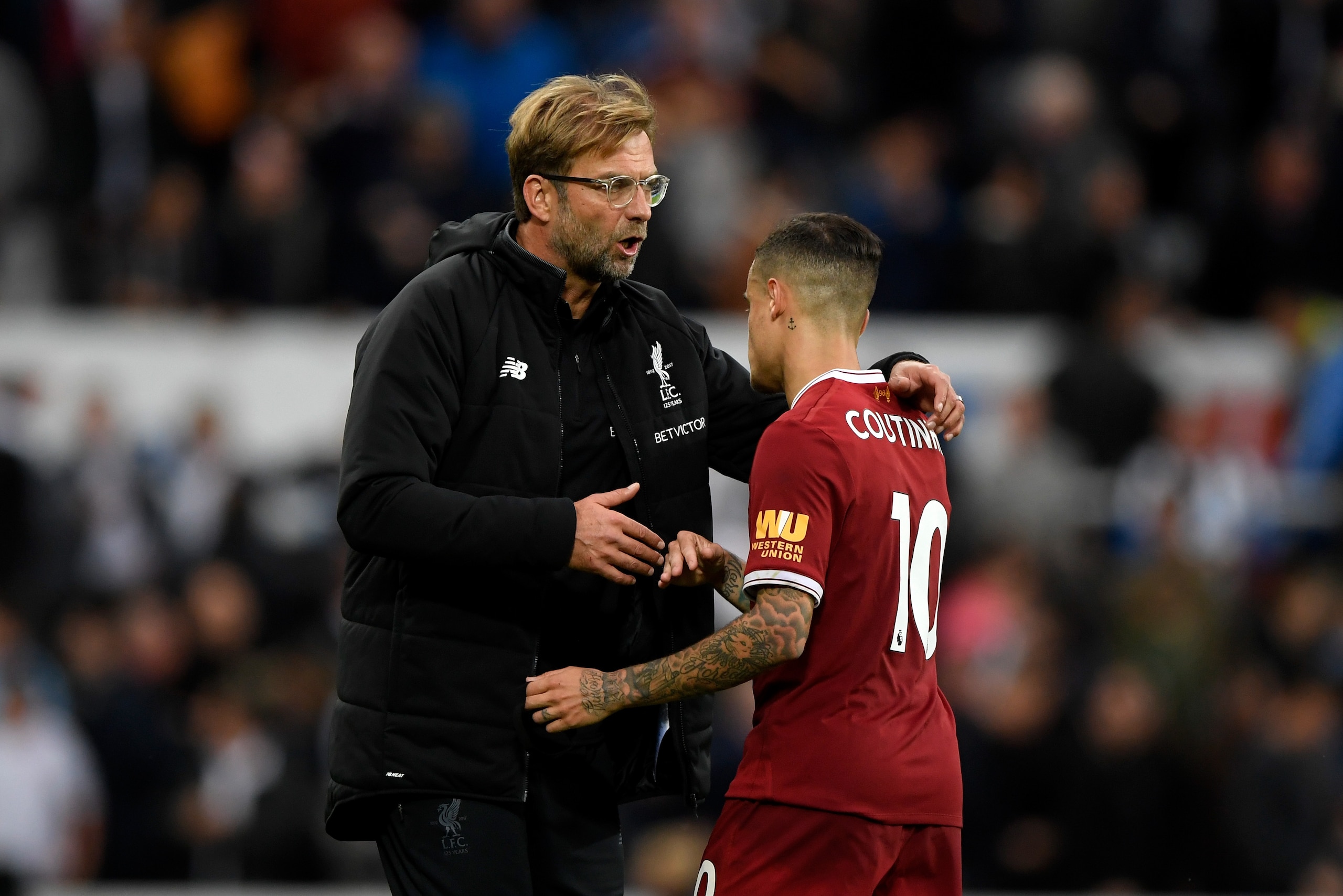 NEWCASTLE UPON TYNE, ENGLAND - OCTOBER 01:  Jurgen Klopp, Manager of Liverpool and Philippe Coutinho of Liverpool embrace after the Premier League match between Newcastle United and Liverpool at St. James Park on October 1, 2017 in Newcastle upon Tyne, En