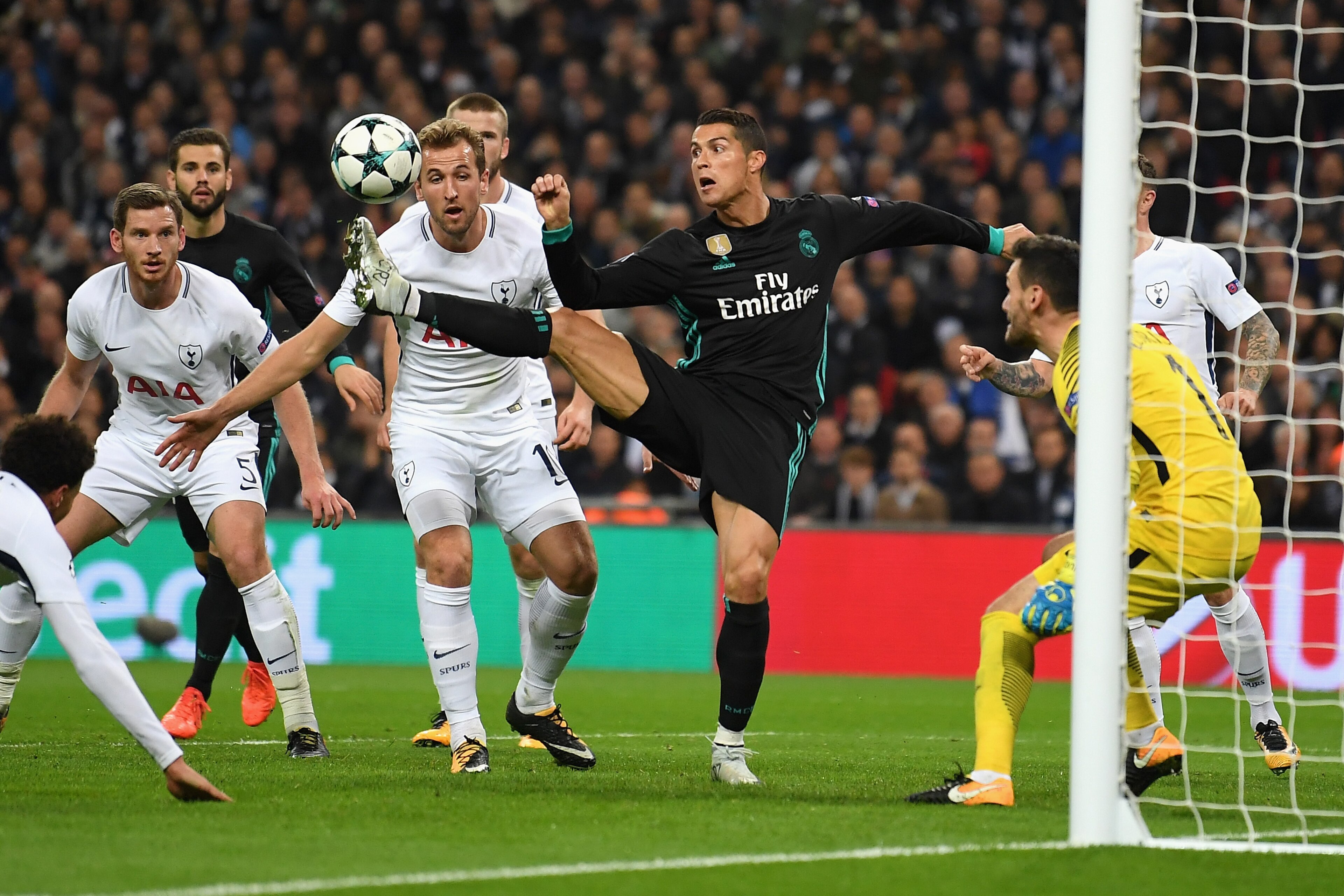 LONDON, ENGLAND - NOVEMBER 01:  Cristiano Ronaldo of Real Madrid and Harry Kane of Tottenham Hotspur battle for the ball during the UEFA Champions League group H match between Tottenham Hotspur and Real Madrid at Wembley Stadium on November 1, 2017 in Lon
