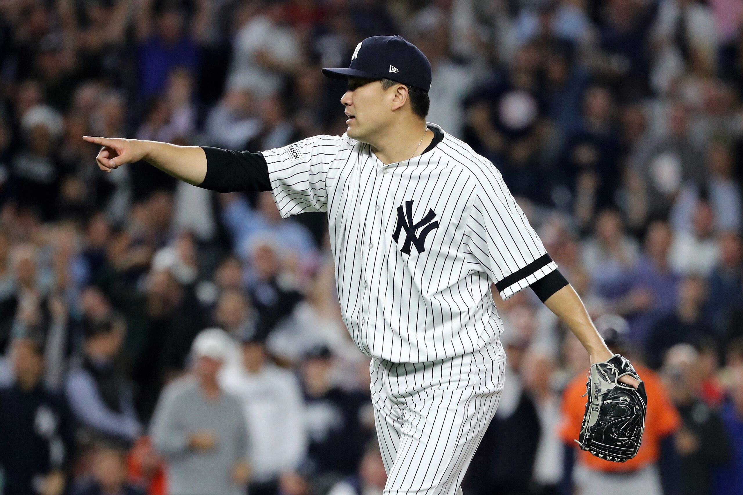 NEW YORK, NY - OCTOBER 18:  Masahiro Tanaka #19 of the New York Yankees reacts after the end of the top of the seventh inning against the Houston Astros in Game Five of the American League Championship Series at Yankee Stadium on October 18, 2017 in the B