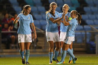 MANCHESTER, ENGLAND - OCTOBER 12:  Jill Scott of Manchester City celebrates with team mates after scoring their second goal during the UEFA Women's Champions League match between Manchester City Ladies and St. Polten Ladies at Manchester City Football Aca