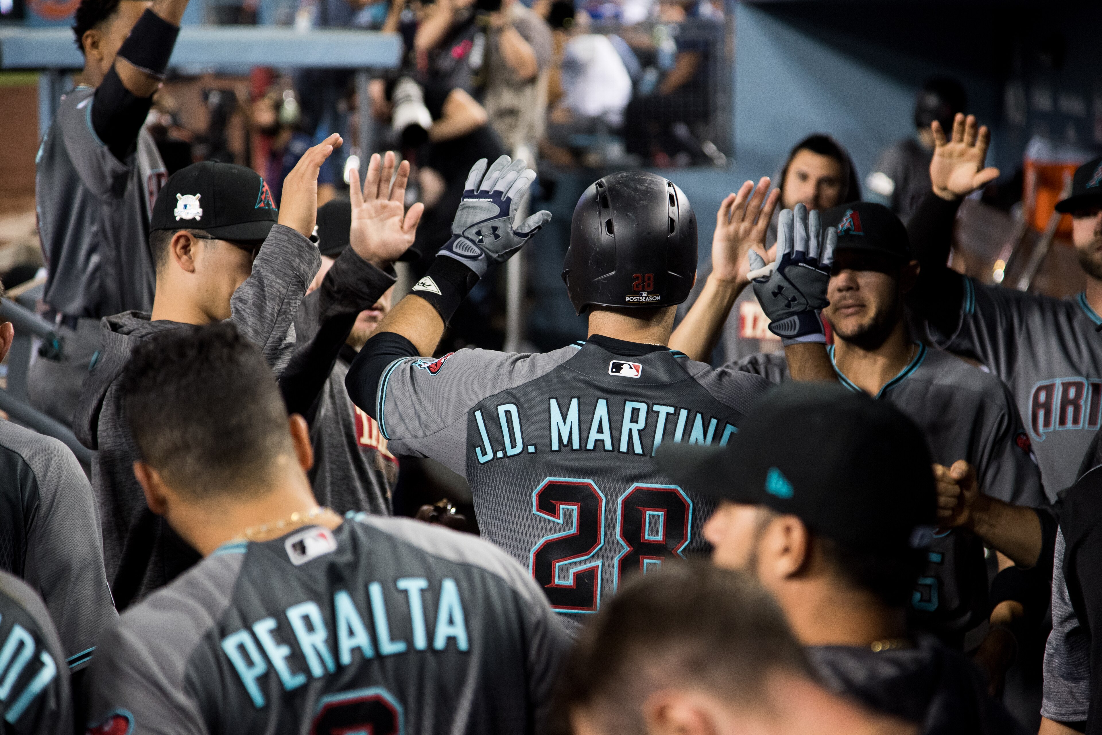 LOS ANGELES, CA - OCTOBER 6: J.D. Martinez #28 of the Arizona Diamondbacks celebrates after hitting a home run during game one of the National League Division Series against the Los Angeles Dodgers at Dodger Stadium on October 6, 2017 in Los Angeles, Cali
