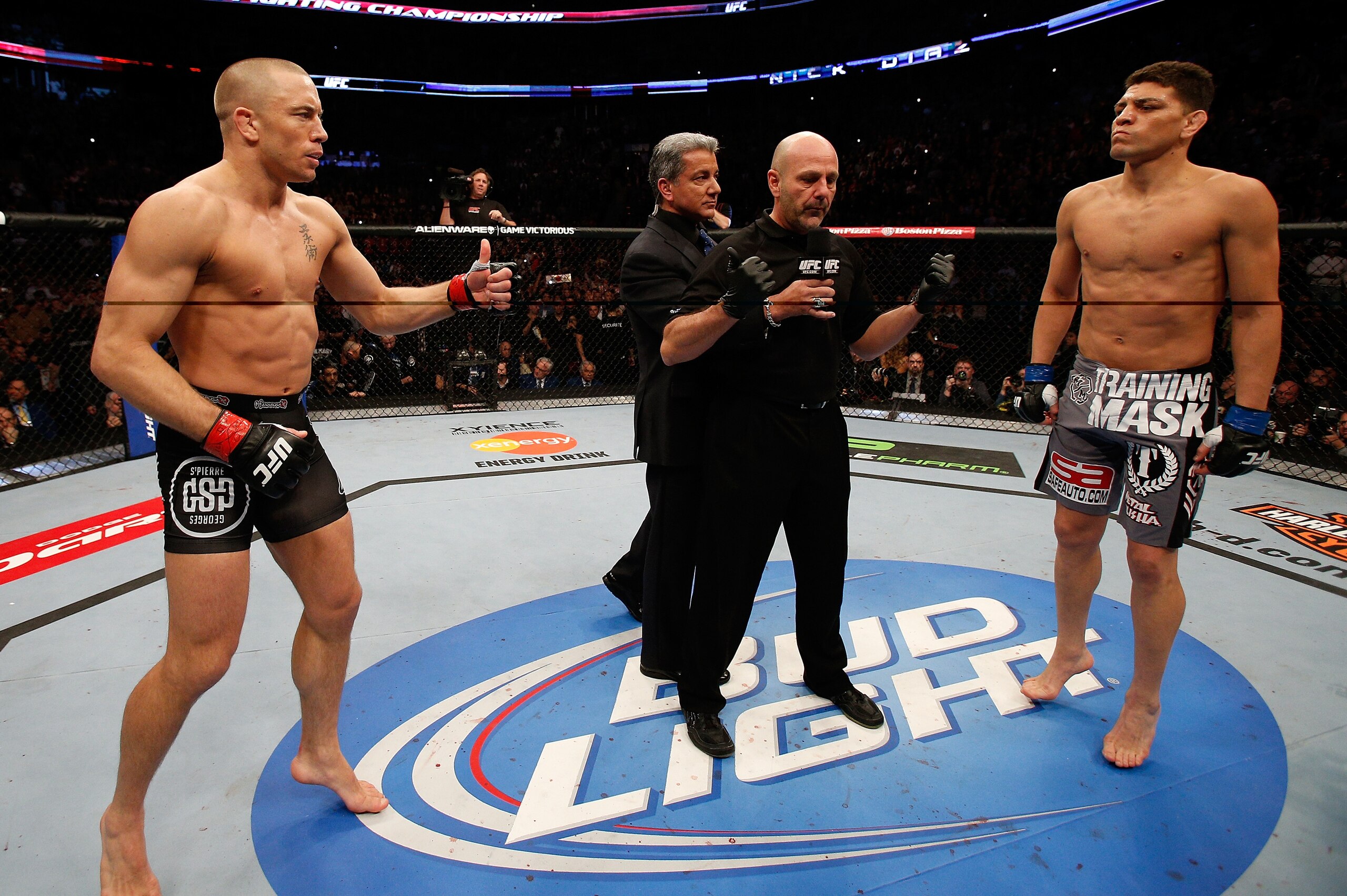 MONTREAL, QC - MARCH 16:  (L-R) Opponents Georges St-Pierre and Nick Diaz face off before their welterweight championship bout during the UFC 158 event at Bell Centre on March 16, 2013 in Montreal, Quebec, Canada.  (Photo by Josh Hedges/Zuffa LLC/Zuffa LL