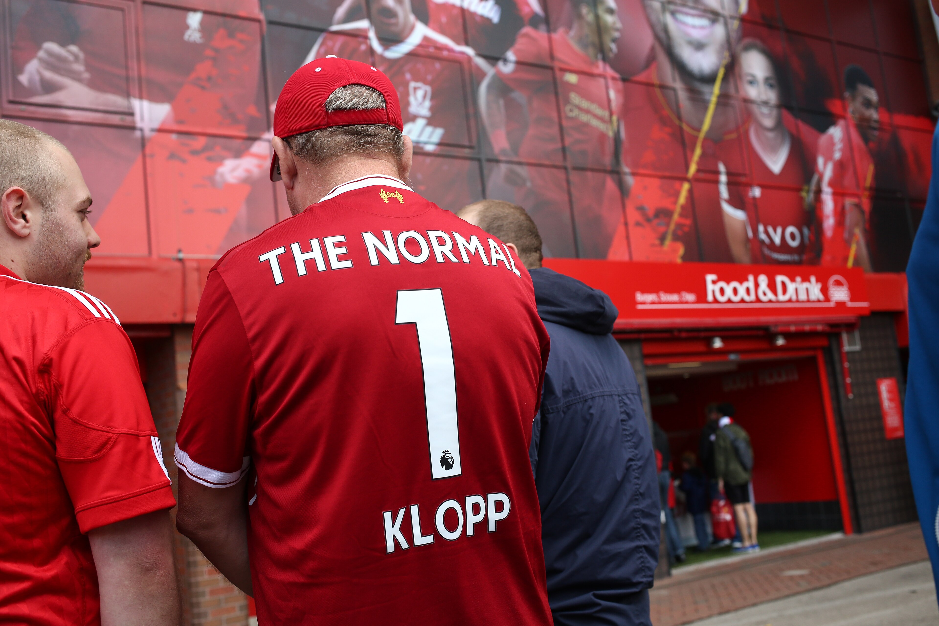 LIVERPOOL, ENGLAND - AUGUST 19: A Liverpool fans wears a shirt that reads The Normal 1 Klopp on the back prior to the Premier League match between Liverpool and Crystal Palace at Anfield on August 19, 2017 in Liverpool, England. (Photo by Robbie Jay Barra