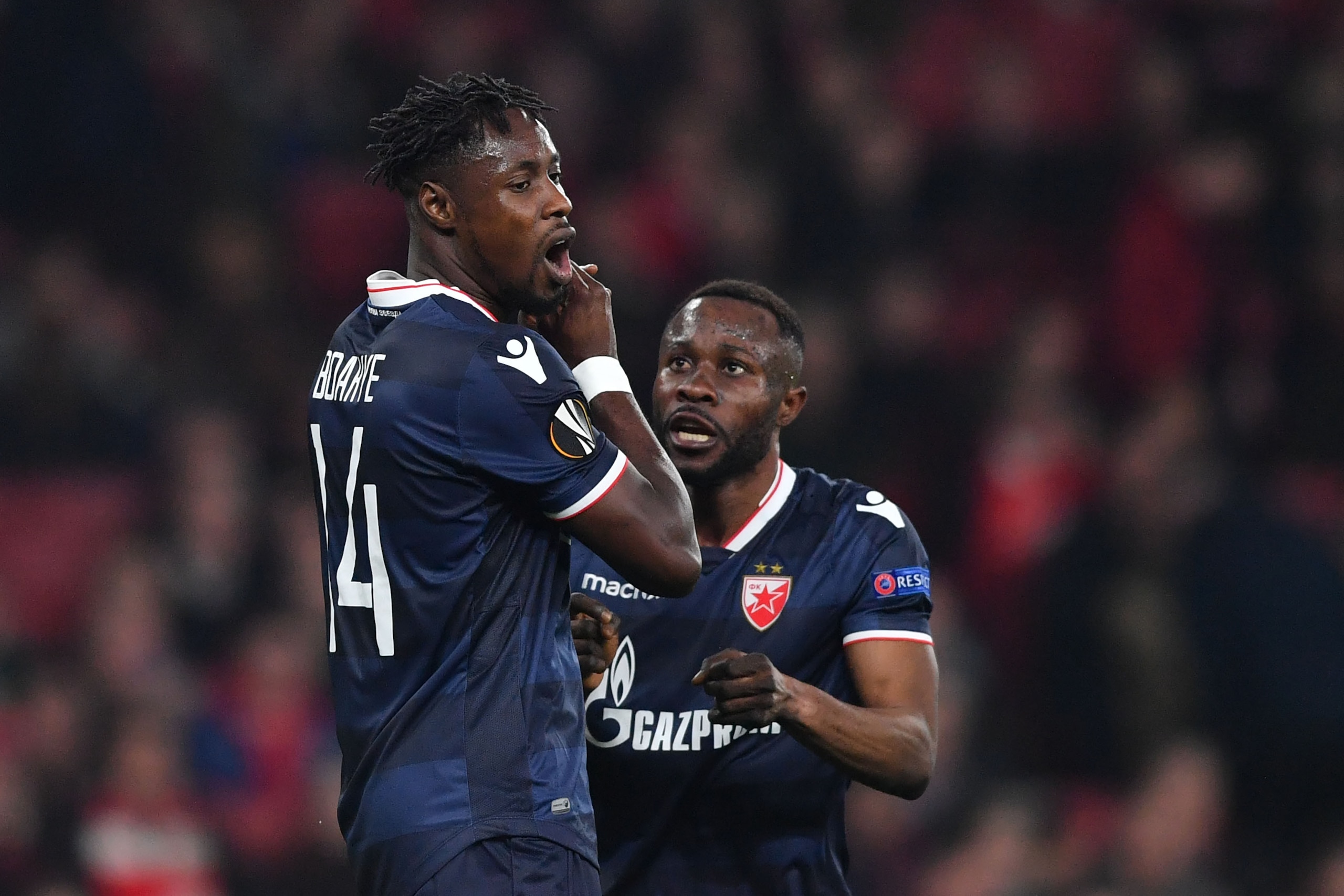Red Star Belgrade's Ghanaian striker Richmond Boakye (L) reacts to a missed oppurtuniy at goal as Red Star Belgrade's Gabonese midfielder Guelor Kanga looks on during the UEFA Europa League Group H football match between Arsenal and Red Star Belgrade at T