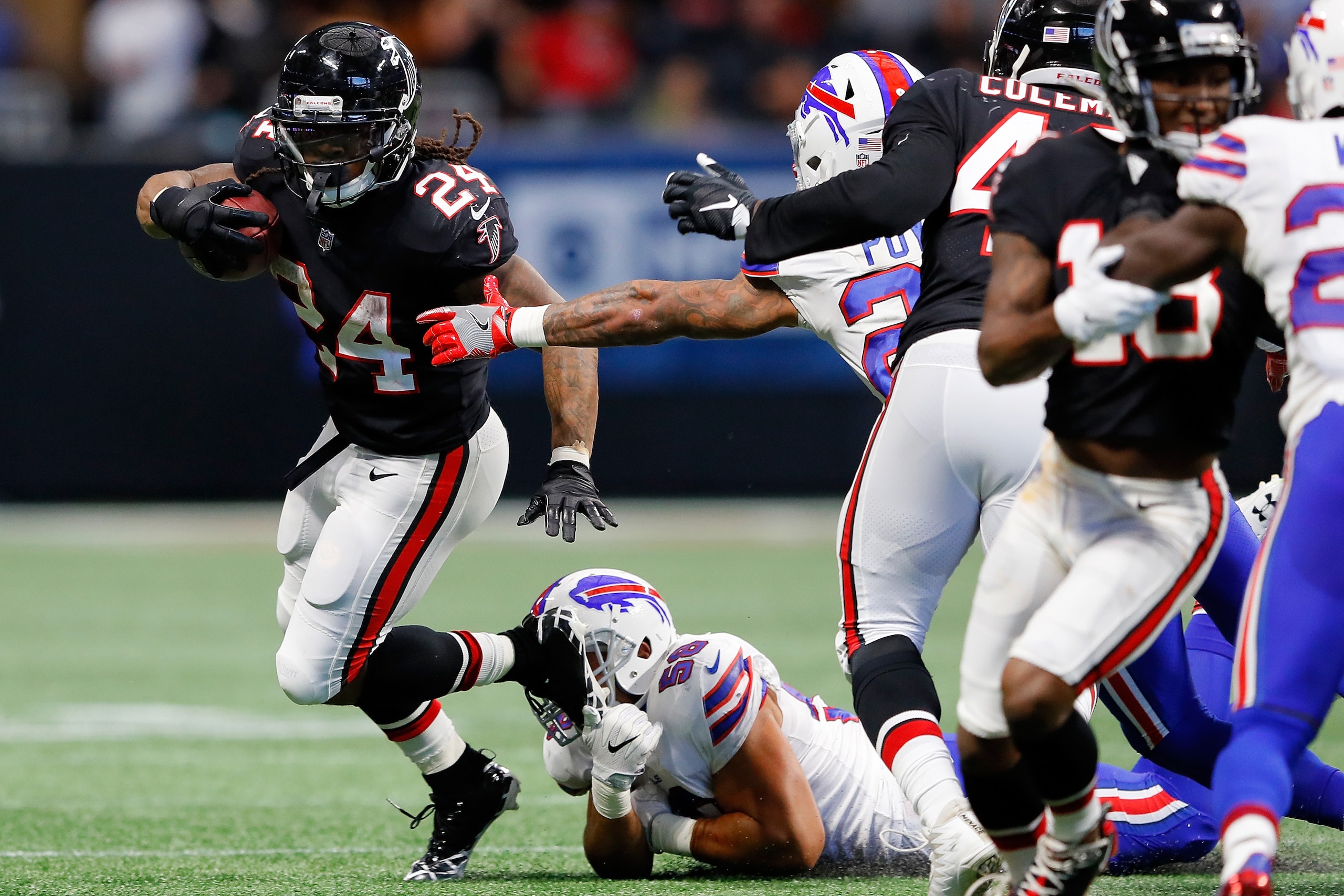 ATLANTA, GA - OCTOBER 01: Devonta Freeman #24 of the Atlanta Falcons runs the ball during the second half against the Buffalo Bills at Mercedes-Benz Stadium on October 1, 2017 in Atlanta, Georgia. (Photo by Kevin C.  Cox/Getty Images)