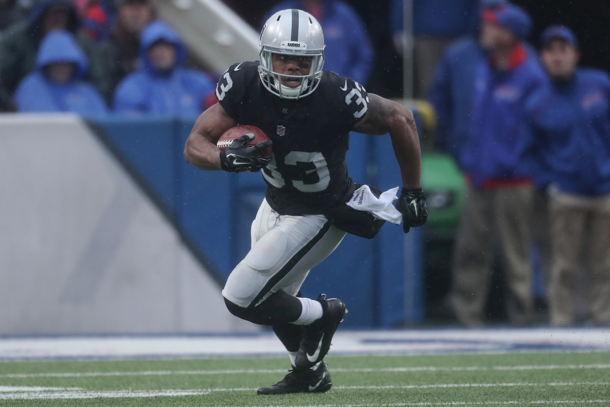 BUFFALO, NY - OCTOBER 29: DeAndre Washington #33 of the Oakland Raiders carries the ball during NFL game action against the Buffalo Bills at New Era Field on October 29, 2017 in Buffalo, New York. (Photo by Tom Szczerbowski/Getty Images)