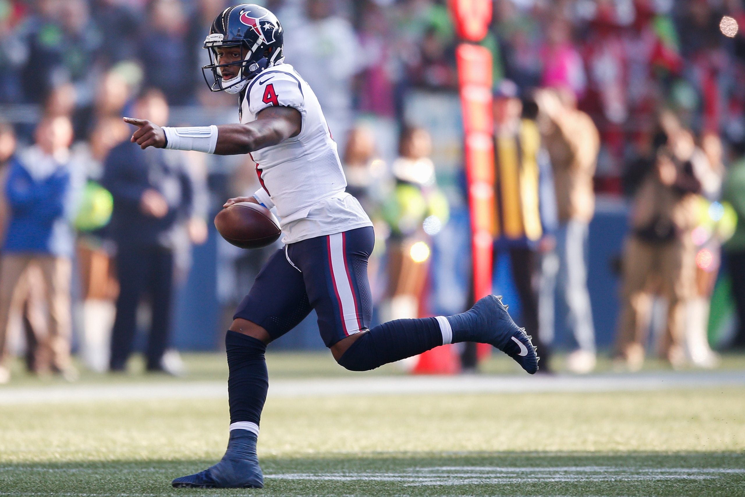 SEATTLE, WA - OCTOBER 29:  Quarterback Deshaun Watson #4 of the Houston Texans points as he rushes against the Seattle Seahawks in the third quarter at CenturyLink Field on October 29, 2017 in Seattle, Washington. (Photo by Otto Greule Jr/Getty Images)