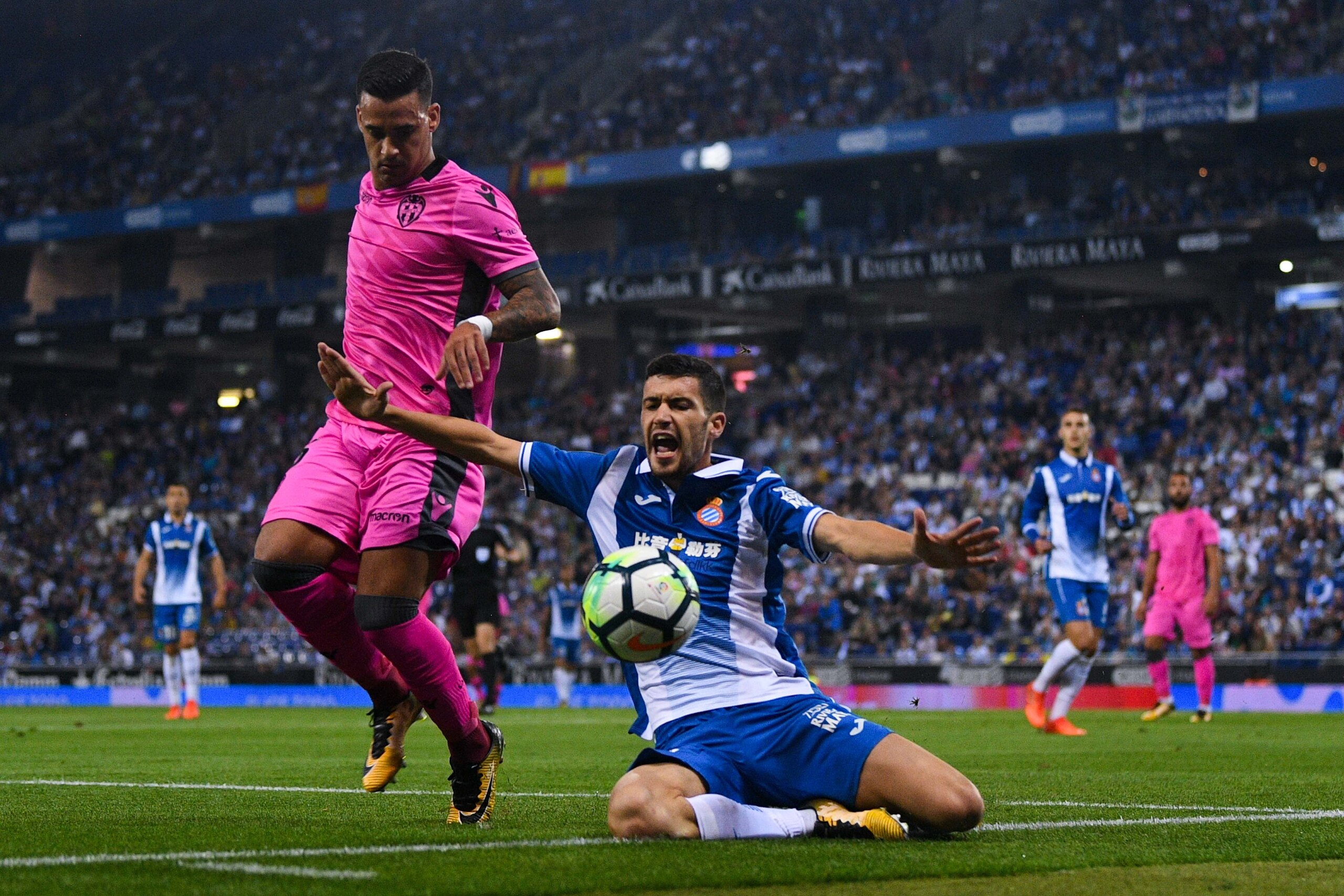 BARCELONA, SPAIN - OCTOBER 13: Nano Mesa of Levante UD competes for the ball with Aaron Martin of RCD Espanyol during the La Liga match between Espanyol and Levante at Cornella-El Prat stadium  on October 13, 2017 in Barcelona, Spain.  (Photo by David Ram