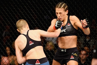 NEW YORK, NY - NOVEMBER 04: Rose Namajunas lands a punch against Joanna Jedrzejczyk of Poland  in their UFC women's strawweight championship bout during the UFC 217 event at Madison Square Garden on November 4, 2017 in New York City.  (Photo by Josh Hedge