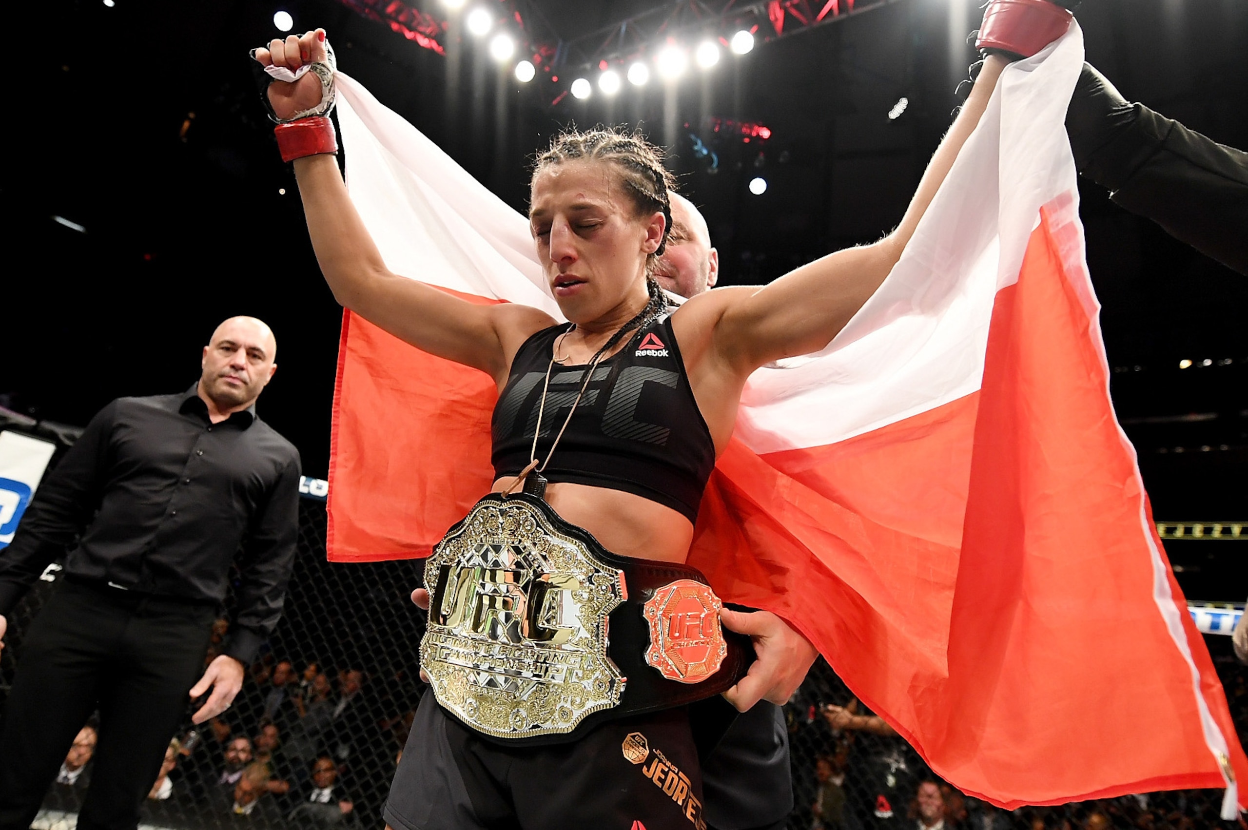 NEW YORK, NY - NOVEMBER 12: Joanna Jedrzejczyk of Poland is awarded the belt after her unanimous decision victory in their women's strawweight championship bout against Karolina Kowalkiewicz of Poland during the UFC 205 event at Madison Square Garden on NEW YORK, NY - NOVEMBER 12: Joanna Jedrzejczyk of Poland is awarded the belt after her unanimous decision victory in their women's strawweight championship bout against Karolina Kowalkiewicz of Poland during the UFC 205 event at Madison Square Garden on