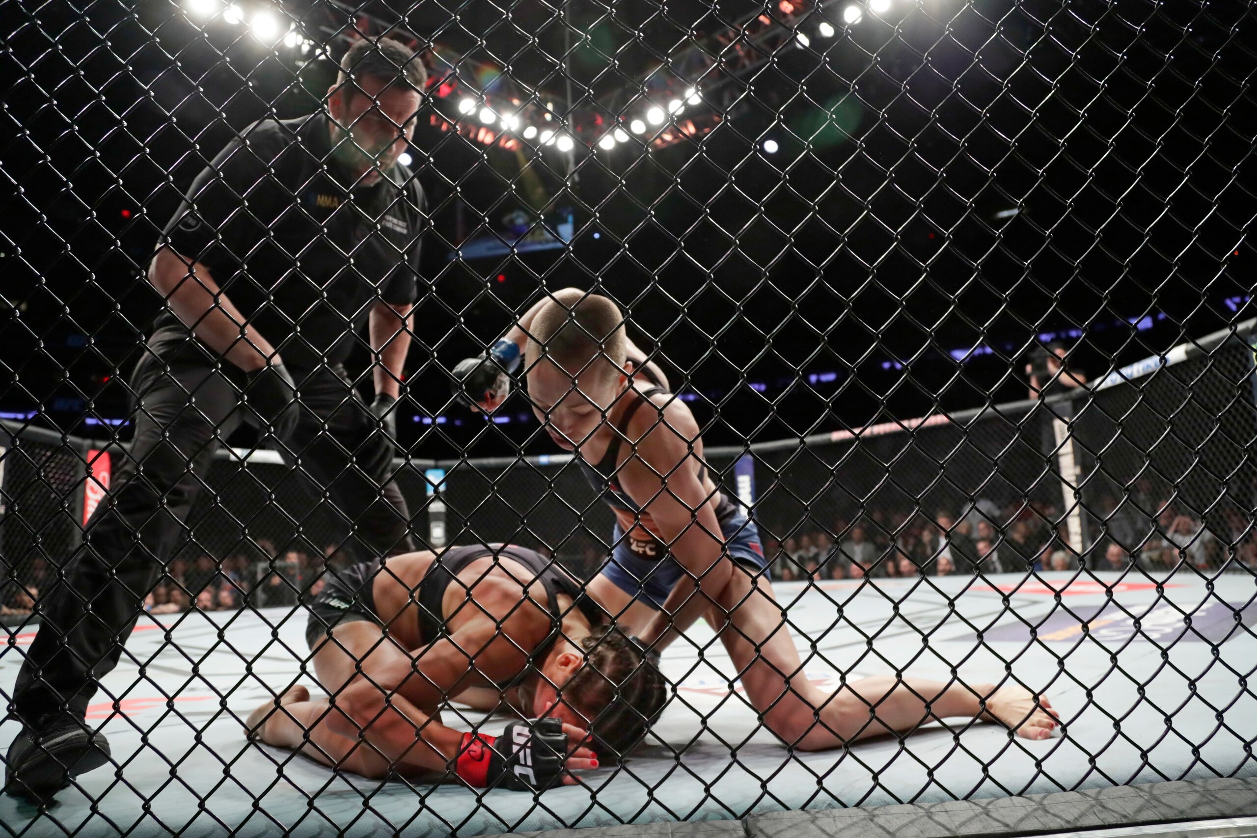 Namajunas forces Jedrzejczyk to tap from strikes.