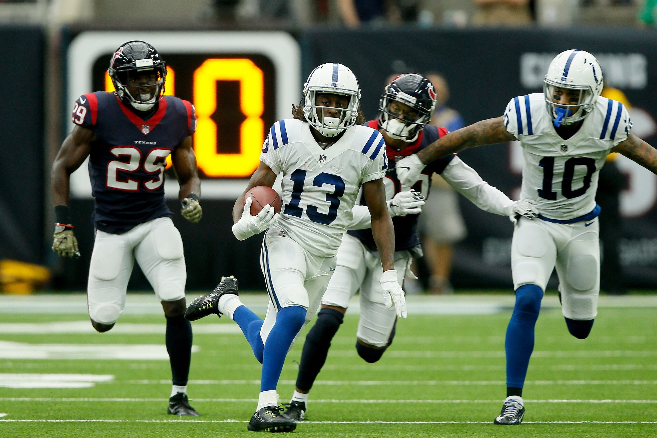 HOUSTON, TX - NOVEMBER 05:  T.Y. Hilton #13 of the Indianapolis Colts runs the ball after a reception defended by Andre Hal #29 of the Houston Texans during the third quarter at NRG Stadium on November 5, 2017 in Houston, Texas.  (Photo by Bob Levey/Getty