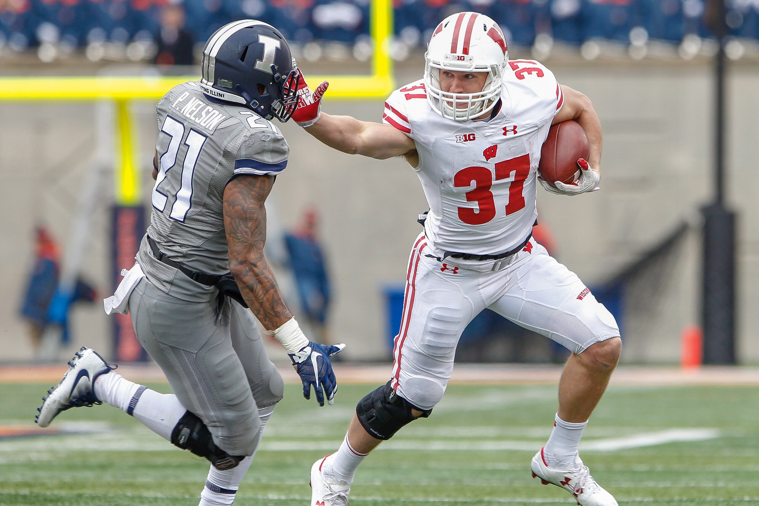 CHAMPAIGN, IL - OCTOBER 28: Garrett Groshek #37 of the Wisconsin Badgers runs the ball during the game against the Illinois Fighting Illini at Memorial Stadium on October 28, 2017 in Champaign, Illinois. (Photo by Michael Hickey/Getty Images)