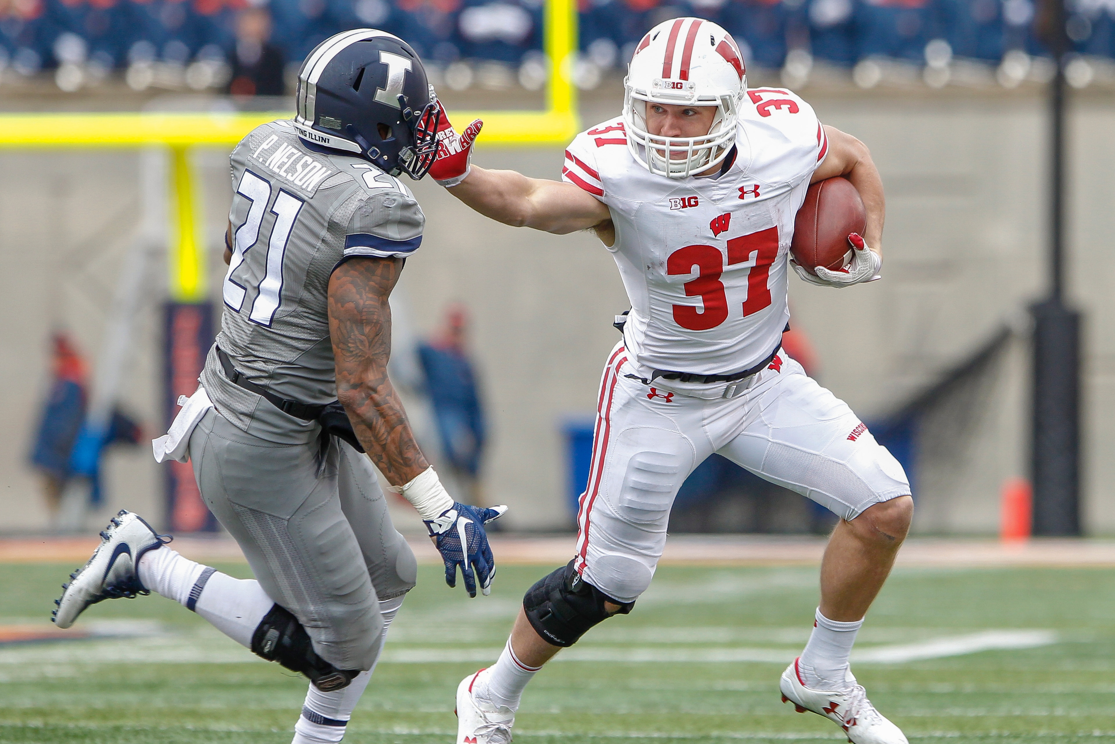 CHAMPAIGN, IL - OCTOBER 28: Garrett Groshek #37 of the Wisconsin Badgers runs the ball during the game against the Illinois Fighting Illini at Memorial Stadium on October 28, 2017 in Champaign, Illinois. (Photo by Michael Hickey/Getty Images)