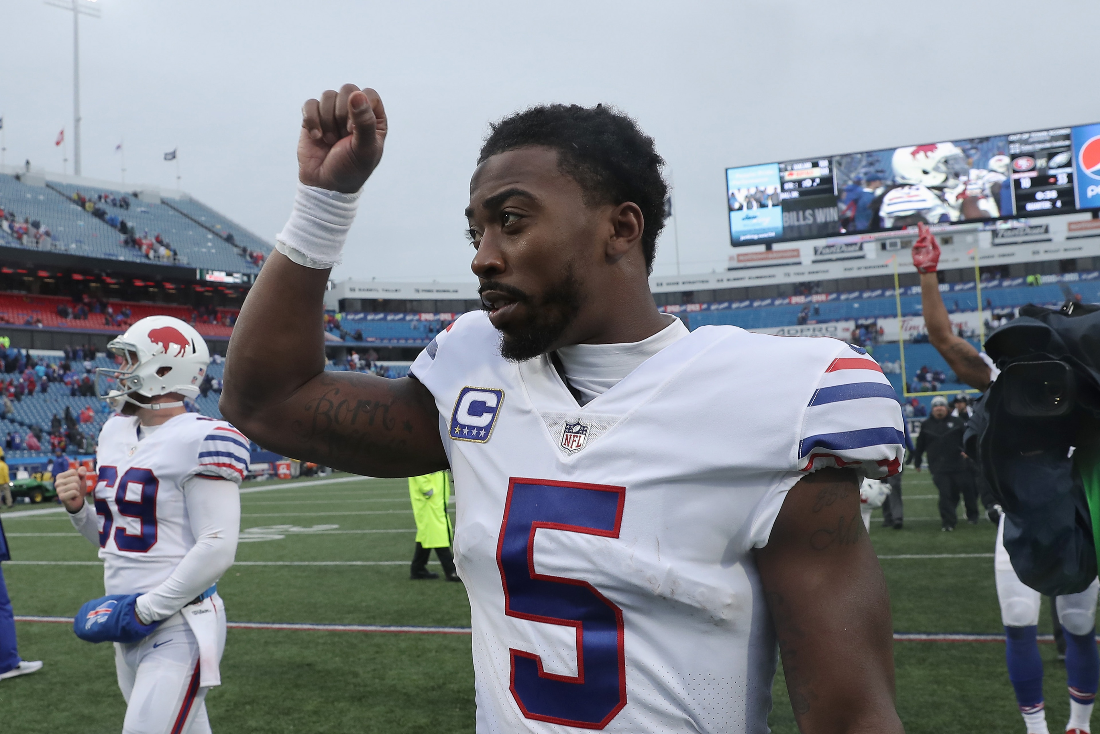BUFFALO, NY - OCTOBER 29: Tyrod Taylor #5 of the Buffalo Bills celebrates their victory as he walks off the field during NFL game action against the Oakland Raiders at New Era Field on October 29, 2017 in Buffalo, New York. (Photo by Tom Szczerbowski/Gett