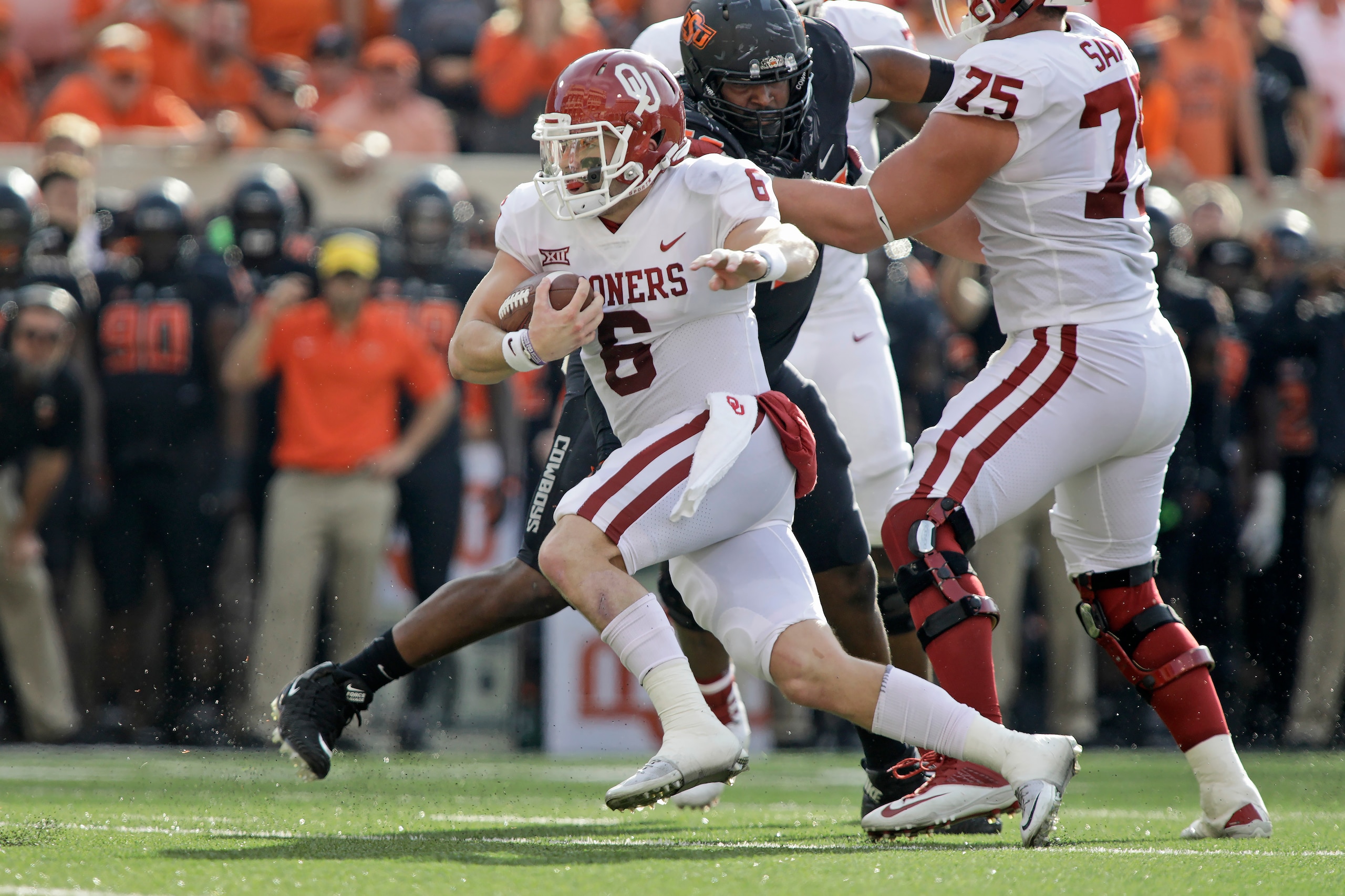STILLWATER, OK - NOVEMBER 04: Quarterback Baker Mayfield #6 of the Oklahoma Sooners scrambles out of the pocket against the Oklahoma State Cowboys at Boone Pickens Stadium on November 4, 2017 in Stillwater, Oklahoma. Oklahoma defeated Oklahoma State 62-52