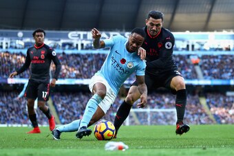 MANCHESTER, ENGLAND - NOVEMBER 05:  Sead Kolasinac of Arsenal and Raheem Sterling of Manchester City battle for possession during the Premier League match between Manchester City and Arsenal at Etihad Stadium on November 5, 2017 in Manchester, England.  (